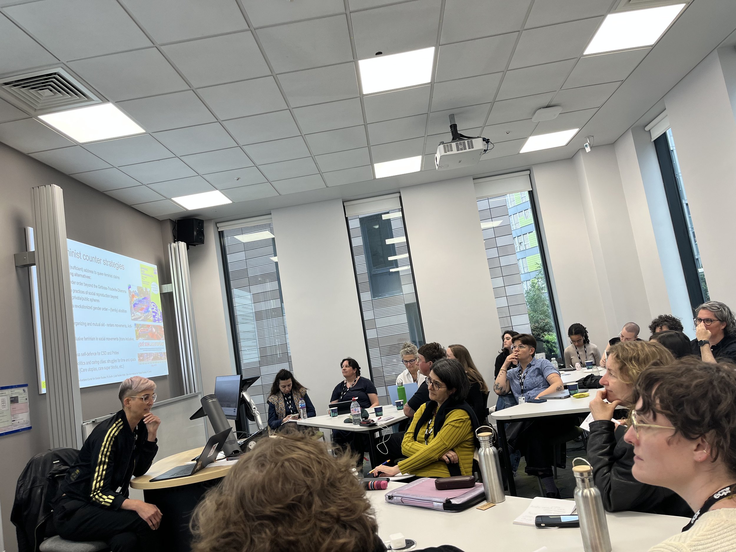Room photo at the Genres of Gender Violence panel, featuring the presenter as well as the audience.