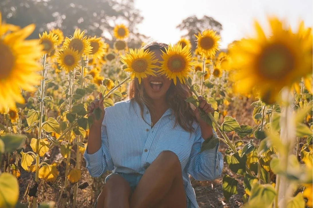 Woman in the Atkins Farm sunflower field.