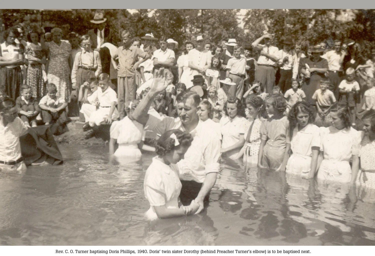Pastor Turner baptizing Doris Phillips in 1940