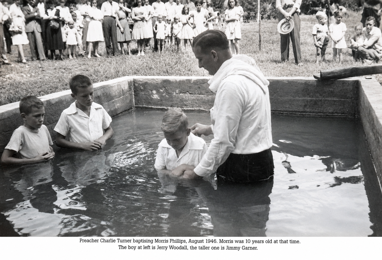 Pastor Turner baptizing Morris Phillips in 1946