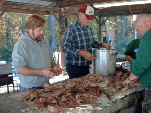 Preparing food at Luxomni's Annual BBQ