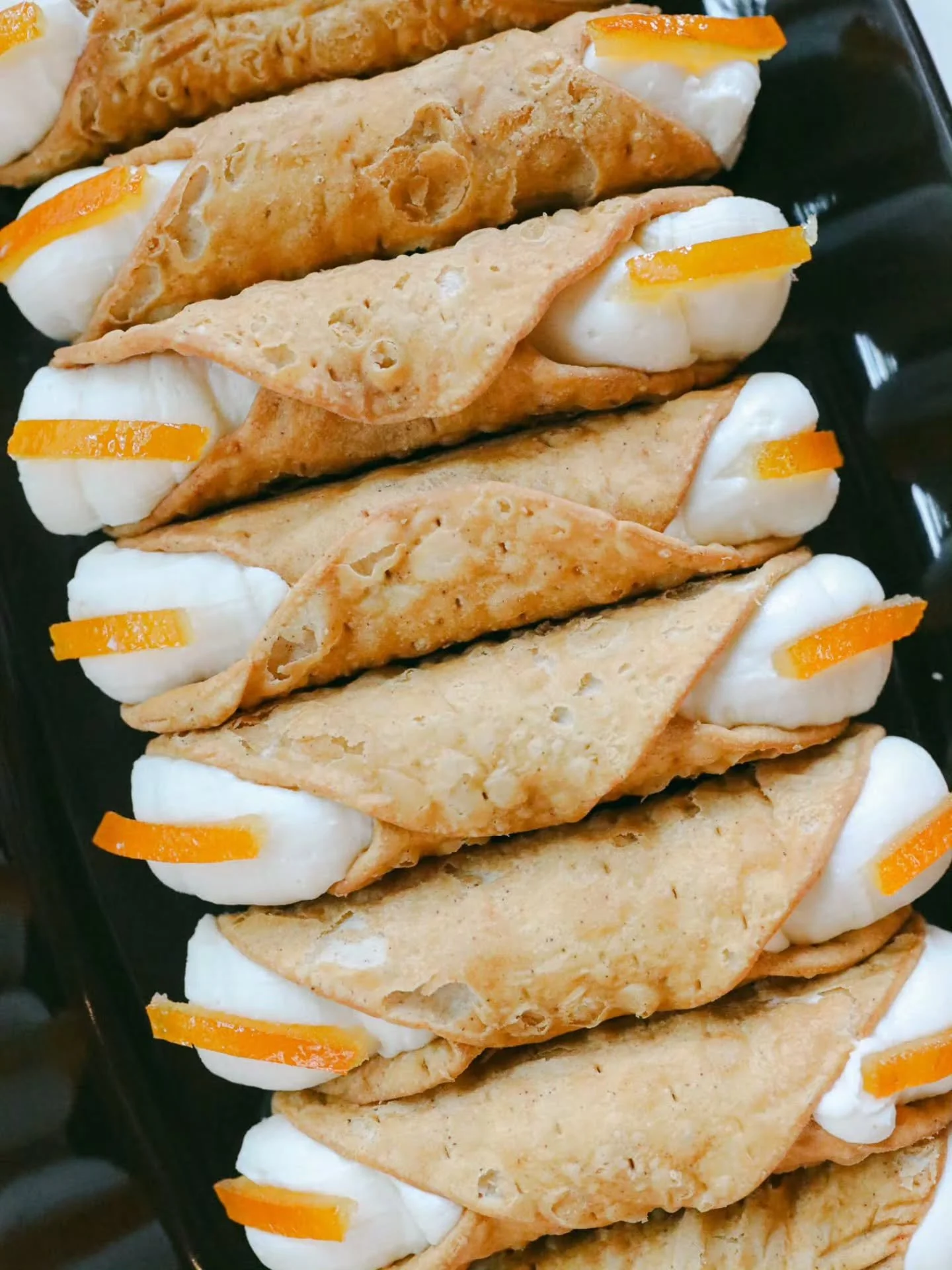 📸 #tbt to our giant cannoli days.

While the size has changed, our cannoli continue to evolve with new and seasonal flavours throughout the year. ✨

Now they're the perfect sweet bite for any occasion.

Who remembers these classics? 🇮🇹🤍

#throwba
