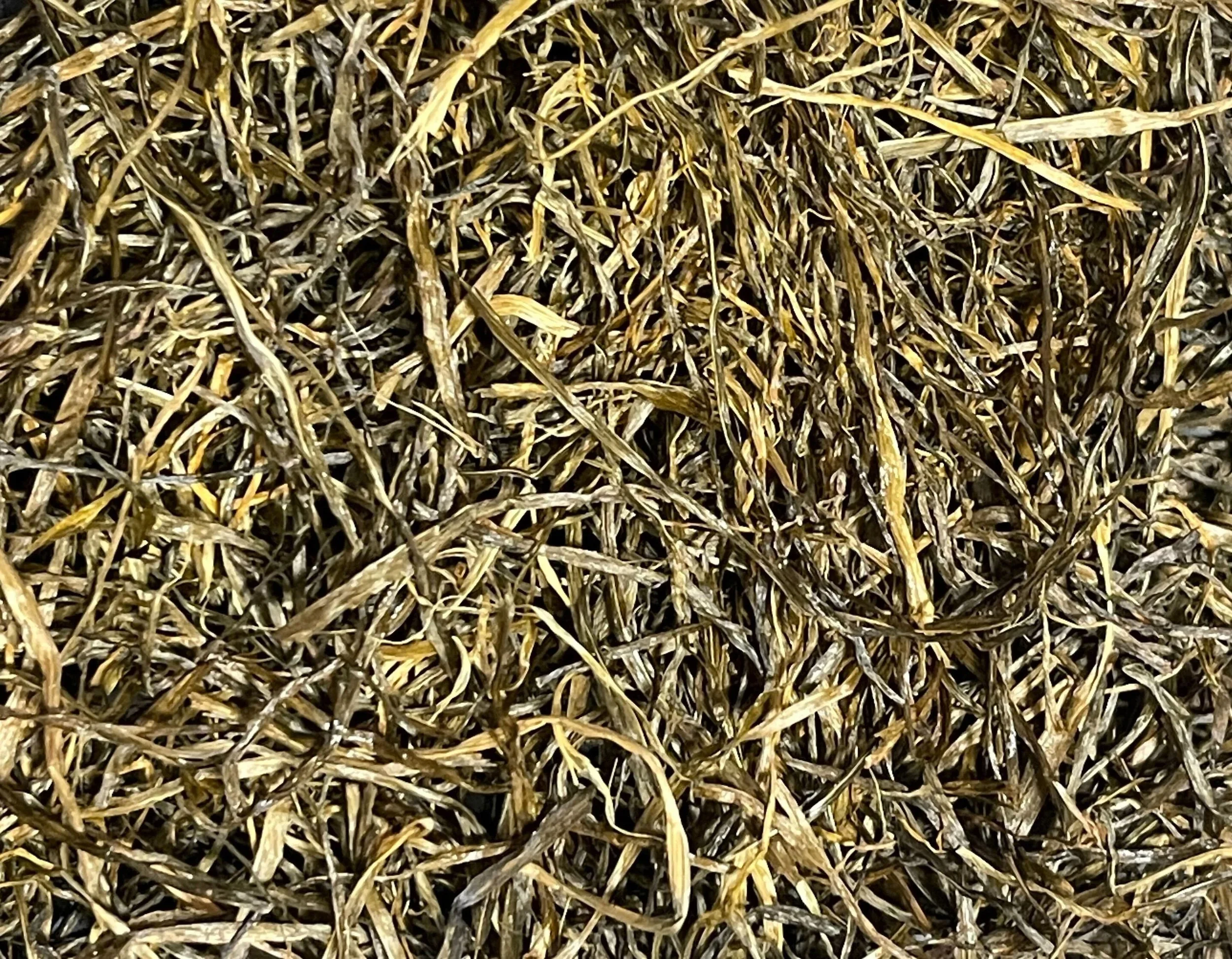 Close-up of dried, overlapping grass or straw.