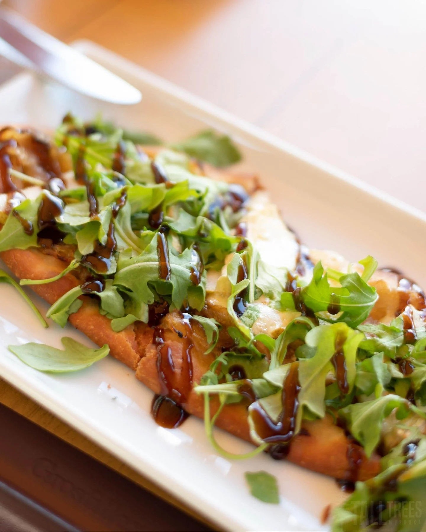 An ode to autumn in Paris&mdash; creamy Brie melts into sweet, tender Bartlett pear and golden caramelized onion. 

With a generous handful of arugula and a drizzle of balsamic reduction to finish, this flatbread is balanced, beautiful and undeniably