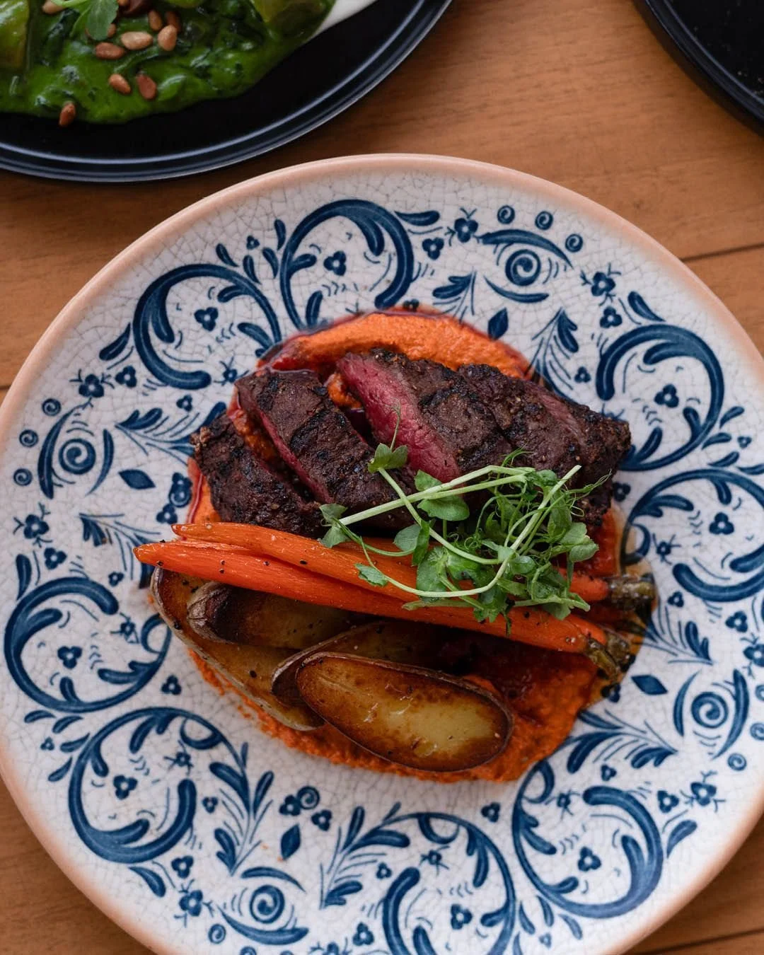 On Wednesdays at Tall Trees, you can get a perfectly cooked 6 oz AAA flat iron steak paired with potatoes, carrots and a romesco sauce, as well as a delicious appetizer and delectable dessert for just $39.99 when you dine off the Wine &amp; Dine Wedn