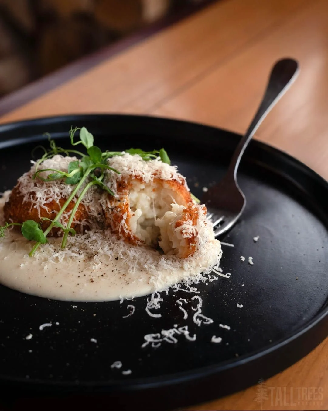 To create our cheesy, peppery, crispy Cacio e Pepe Arancini appetizer, we fused together two famous dishes from different regions of Italy.

Cacio e Pepe is a pasta dish hailing from the Lazio region of Italy with only two simple ingredients topping 