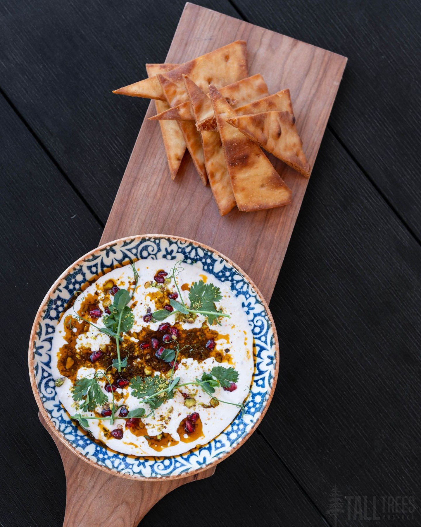 Your Mother&rsquo;s Day dinner at Tall Trees will open with our light and creamy Whipped Feta Dip. ✨

We top the mixture with our tried-and-true carrot top chermoula, toasted pistachios for a crunch, fresh pomegranate seeds for a fruity tang and driz