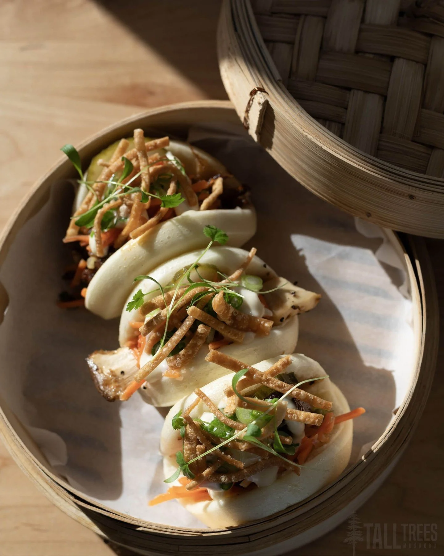 There are countless ways to dress a good bao. Here at Tall Trees, we have three delicious options: Smoked Beef Bao, Fried Pork Belly Bao and the King Oyster Mushroom Bao. 

Each protein option is paired with quick pickled cucumbers, scallions, confit