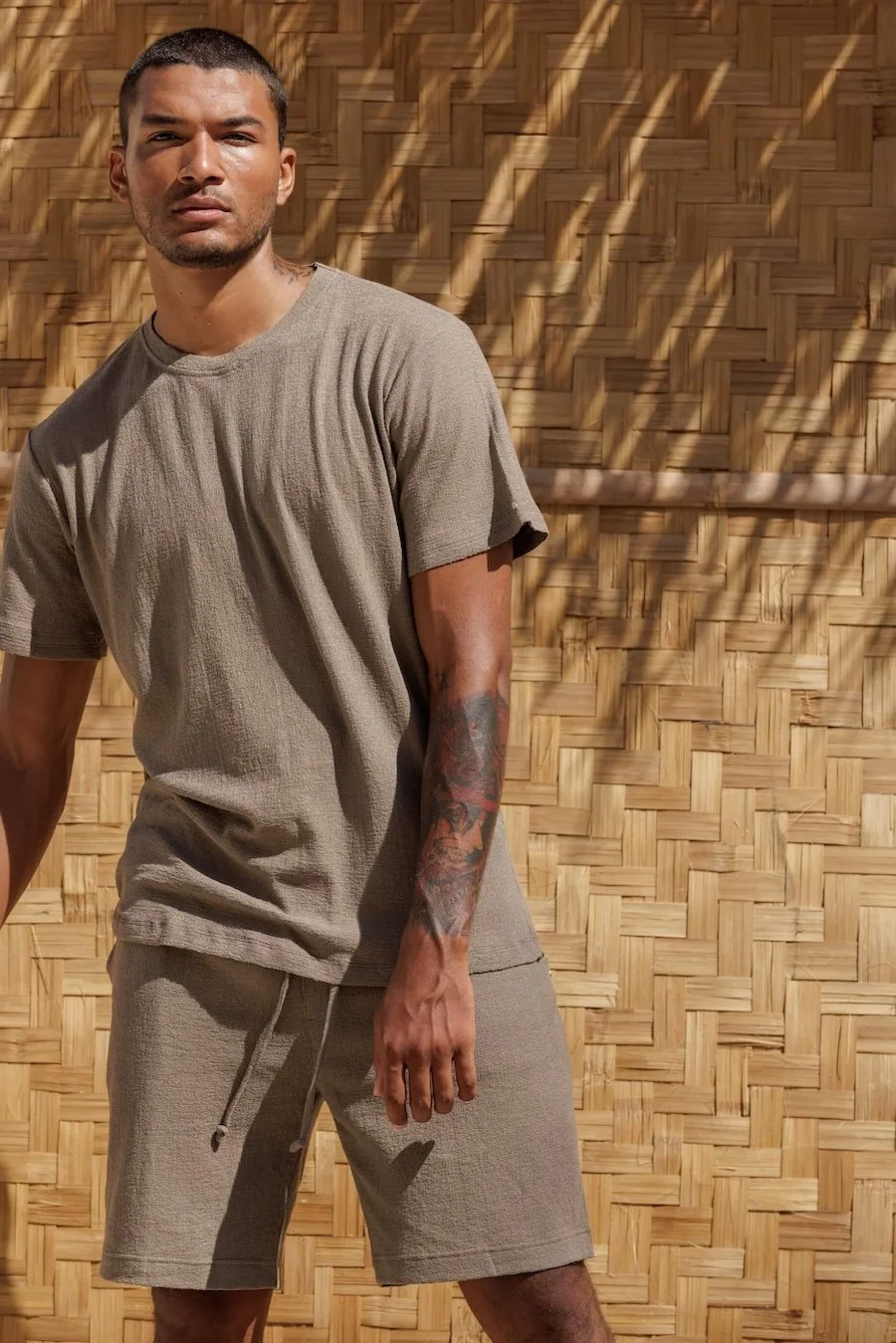 Casual summer style with NOUSA Renclì shorts and matching oversized t-shirt in Ocean Fog green-grey linen-cotton jersey.