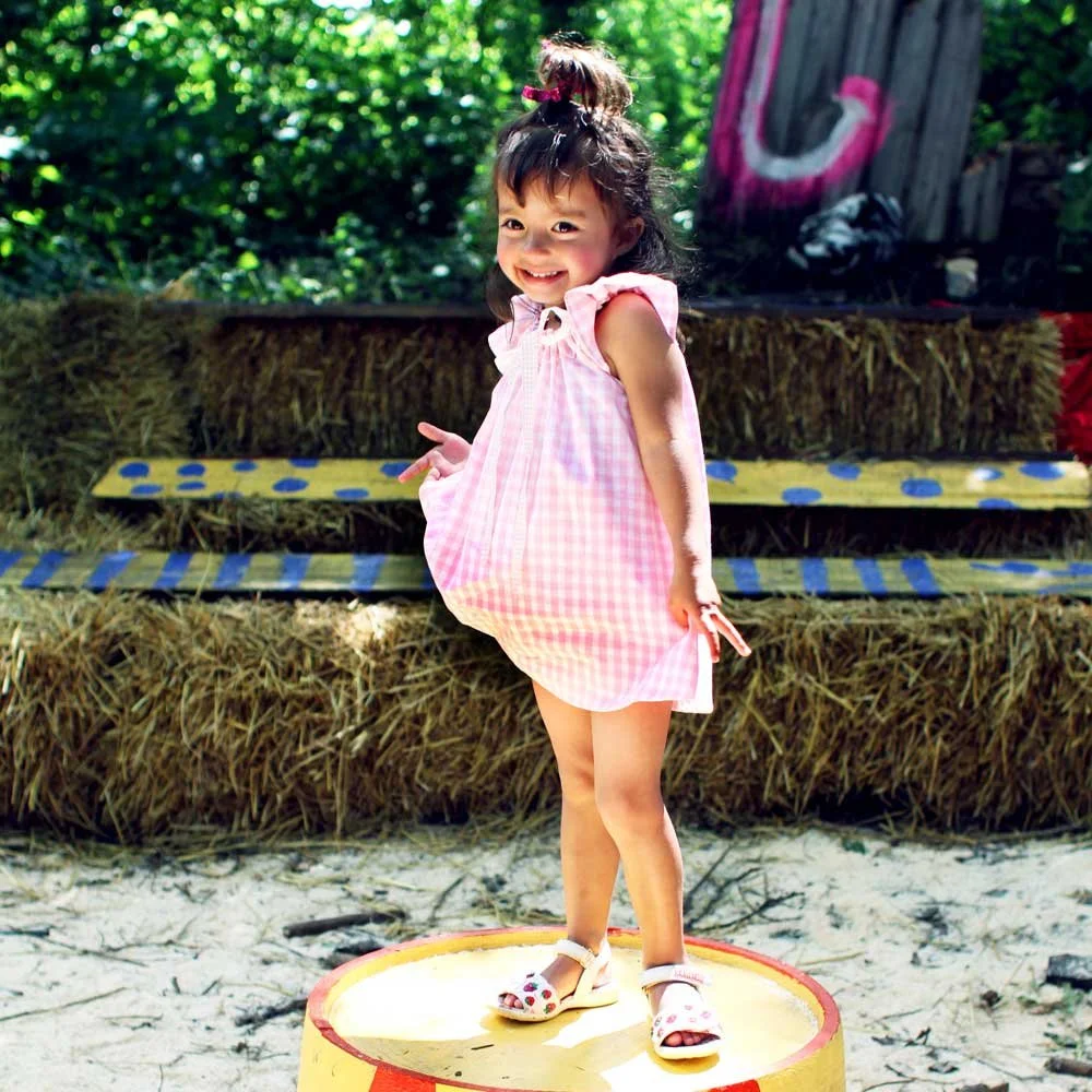 VK902-Gingham-Play-Dress-Pink-Model.jpg