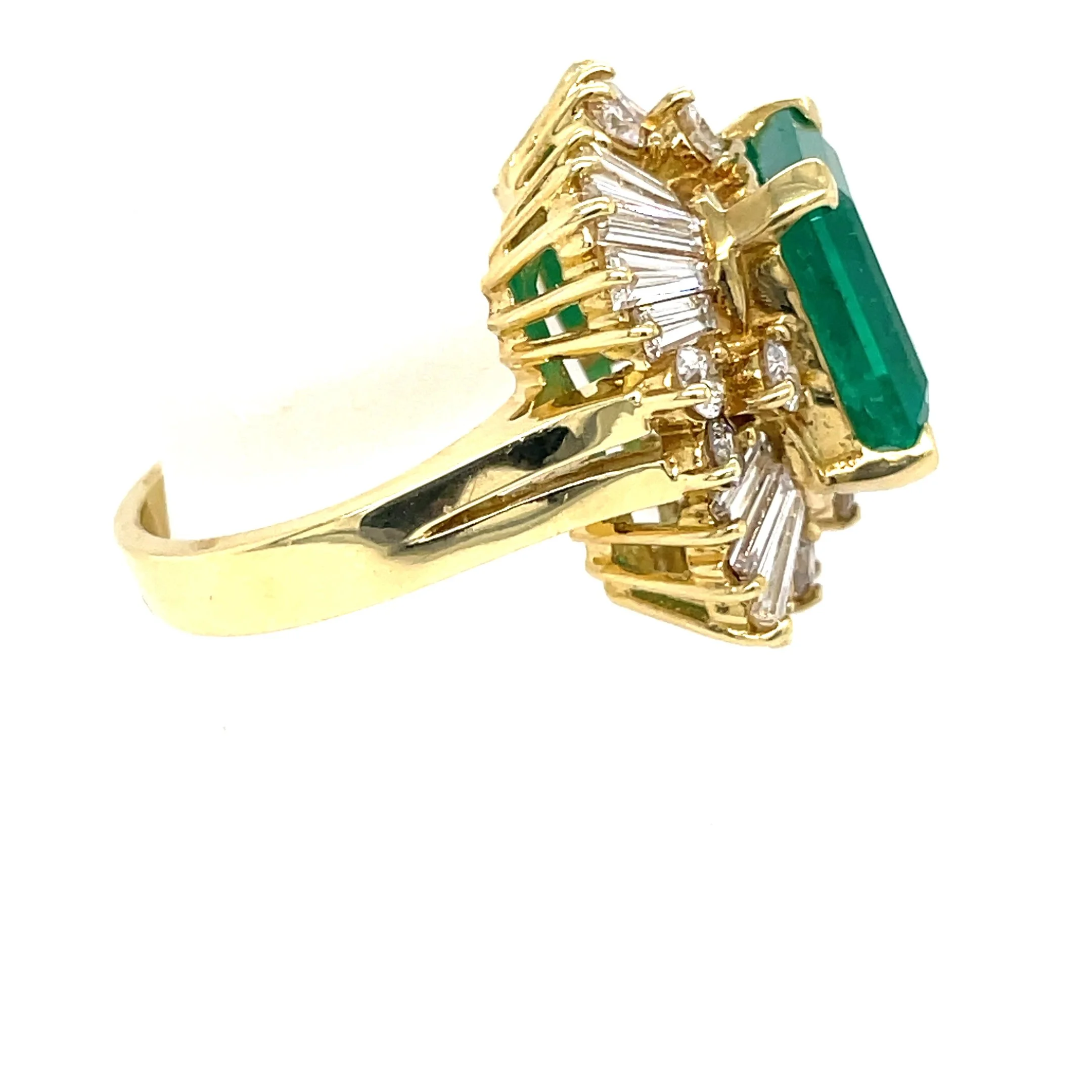 200-1543_18K-Yellow-Gold-7ct-Emerald-Cut-Emerald-Diamond-Ballerina-Halo-Ring-Side-1.jpg