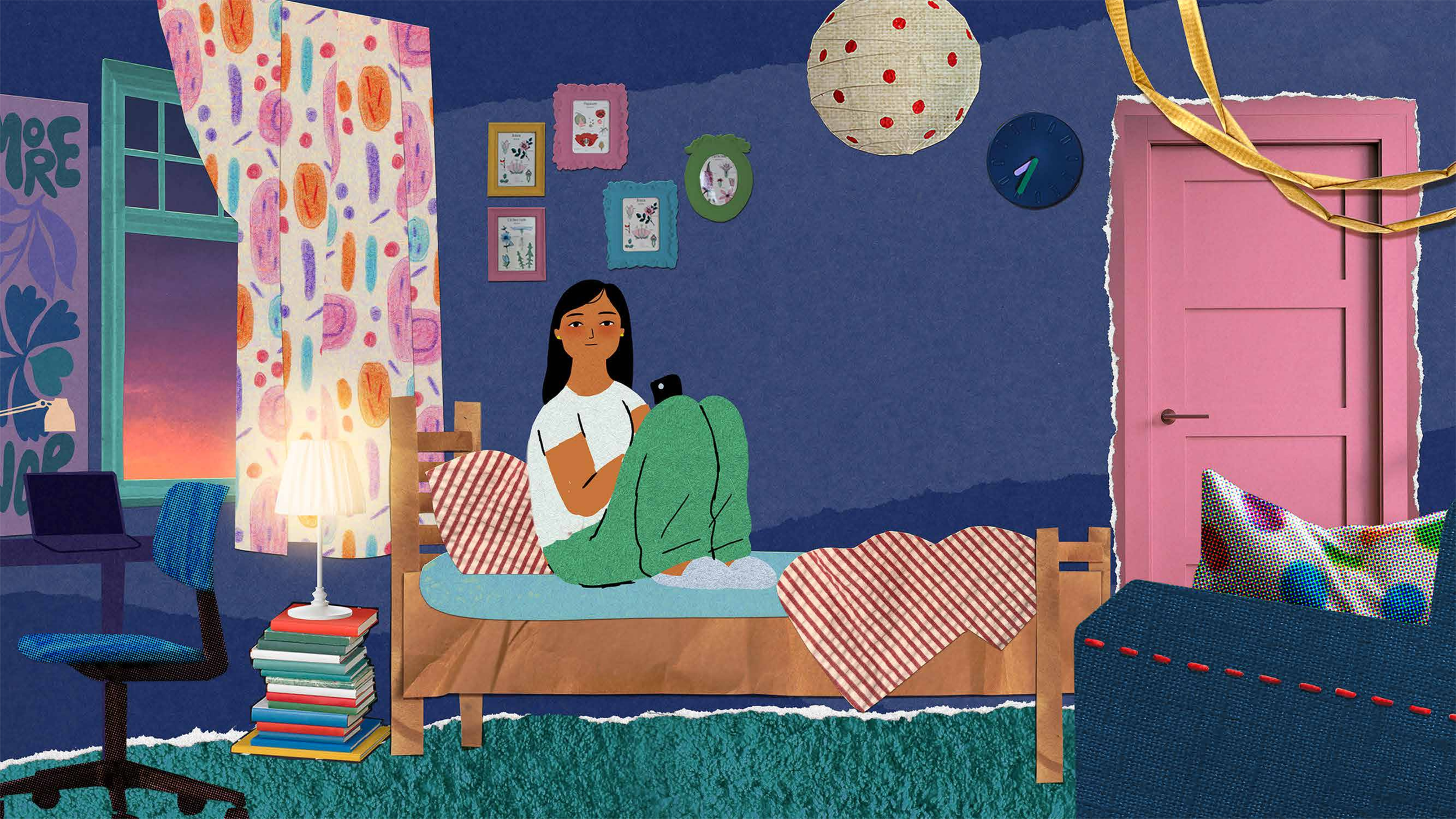 A young woman sitting on a bed in a colorful, decorated bedroom, looking at her phone. The room has a dark blue wall with framed artwork, a pink door with a gold ribbon, a paper lantern, a small table with a stack of books, and a chair with a laptop. The bed has red and white striped blankets and a multicolored pillow.