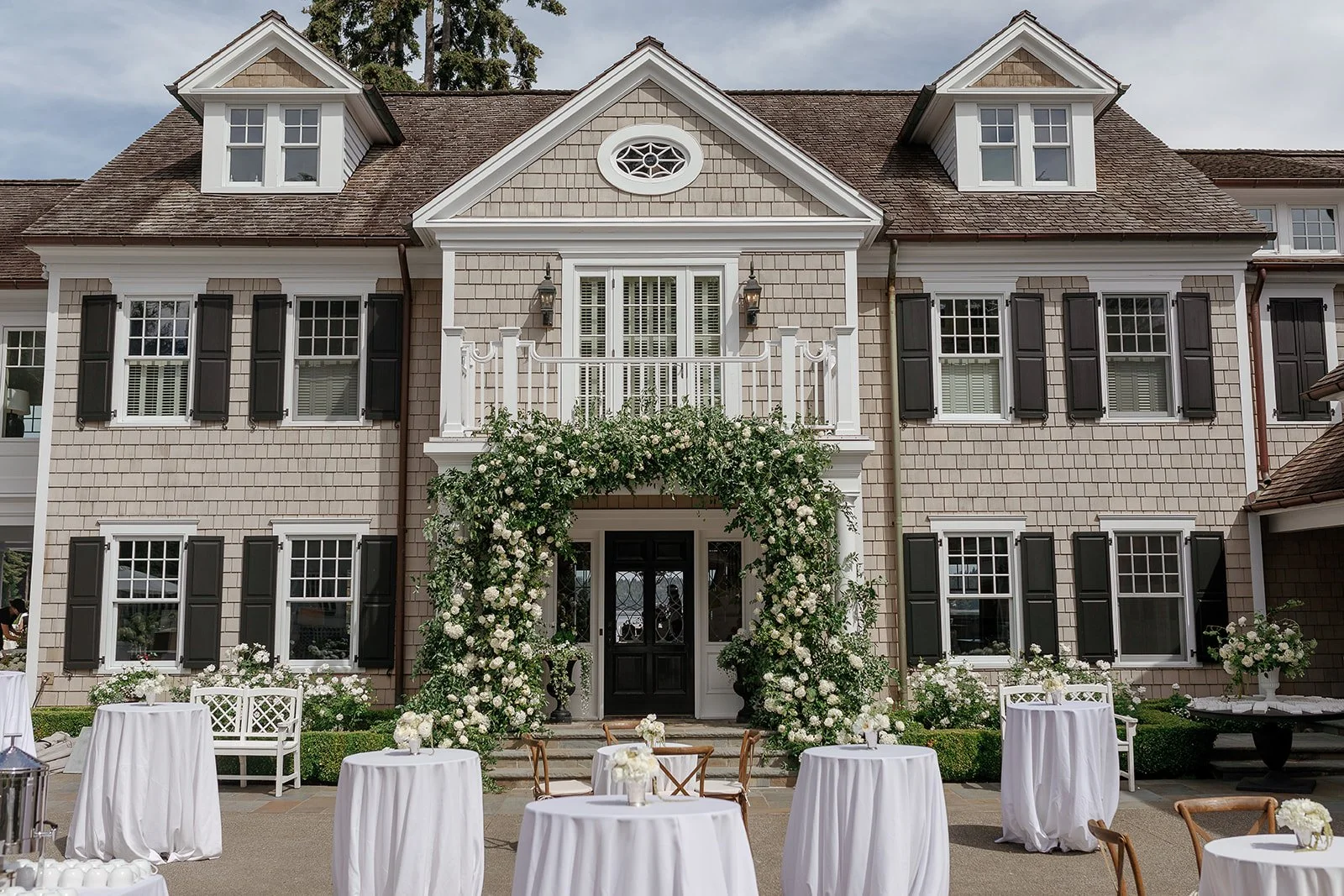 East Coast Mansion with greenery entry way 