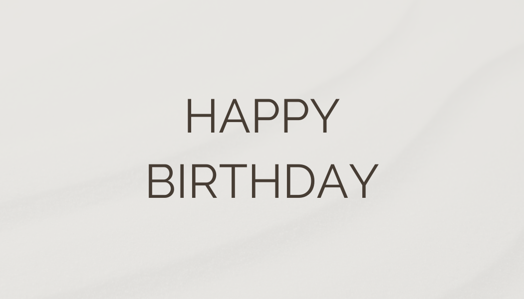 A white background with the text 'HAPPY BIRTHDAY' written in black capital letters.