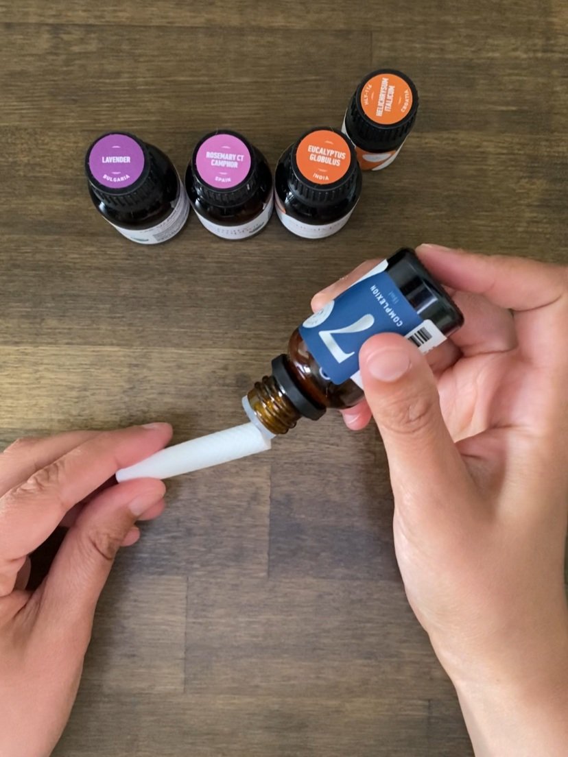 Assembling the Inhalers. Dropping the oil onto the cotton wicks.