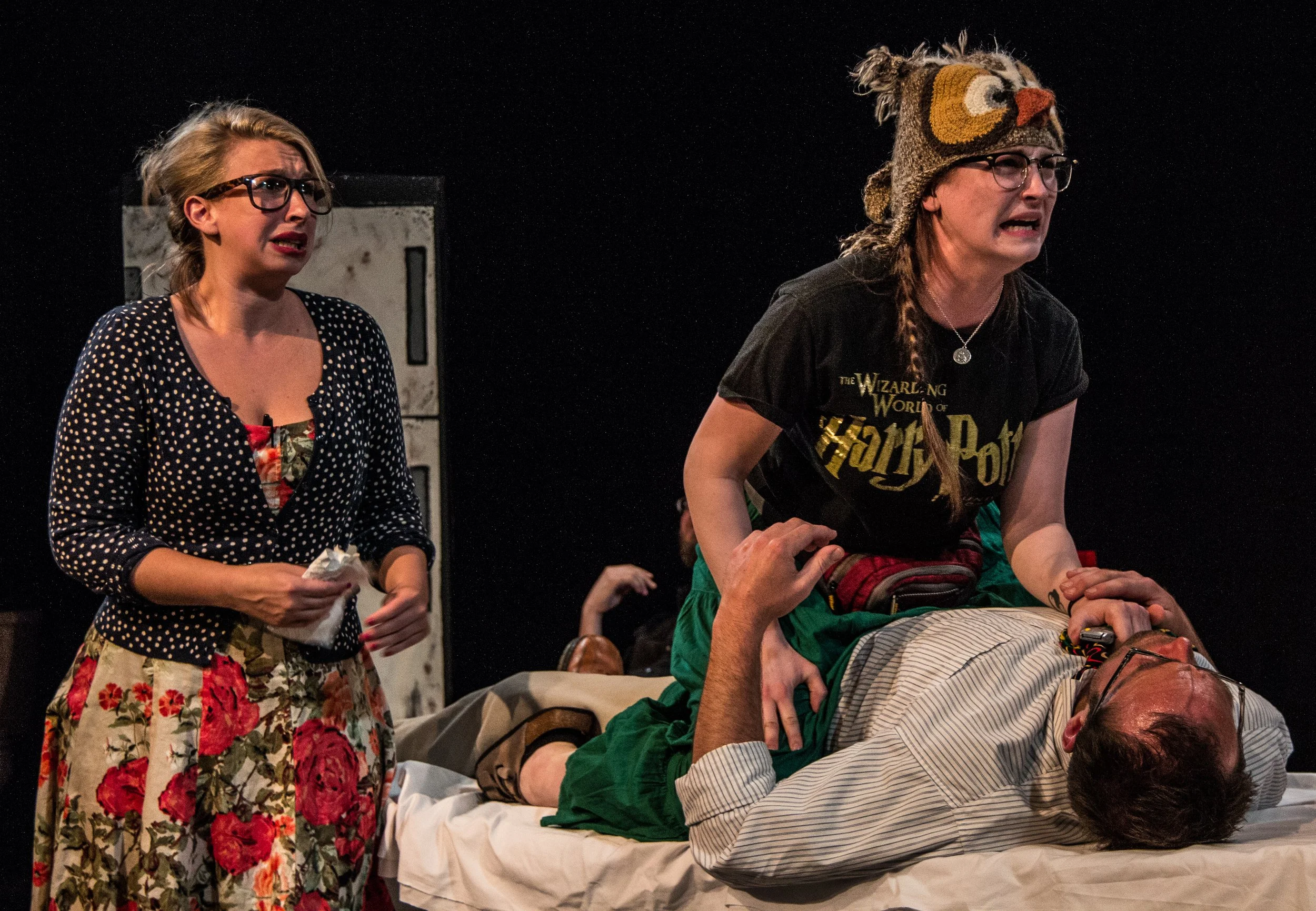 Paulette [Leah Strasser] contemplates killing Gary (Nathan Neorr), who doesn't necessarily object. Susan (Lisa DeRoberts) looks on. [Photo by Daniel R. Winters]