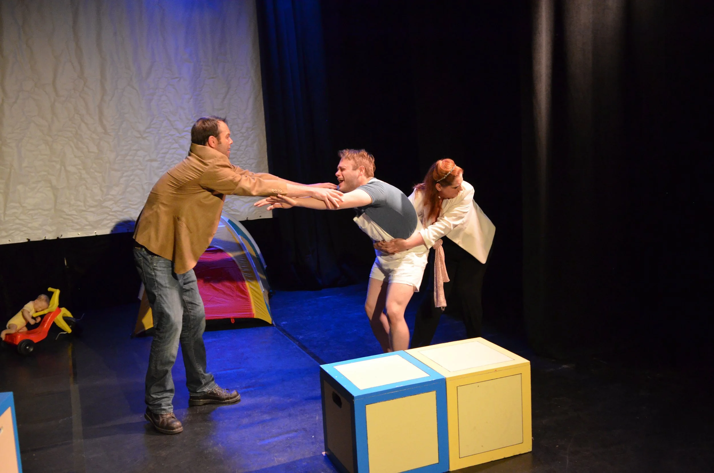 Brandon (Dudley) is pulled away from his nanny Frank (Nathan Neorr) by his mother (Tonya McGriff) [Photo by Jeff Burkle]