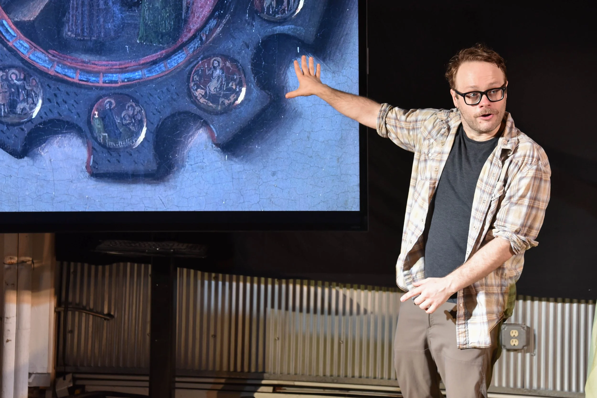 Ben stalls by pointing out details in Jan van Eyck's painting. (Photo by Jeff Burkle)