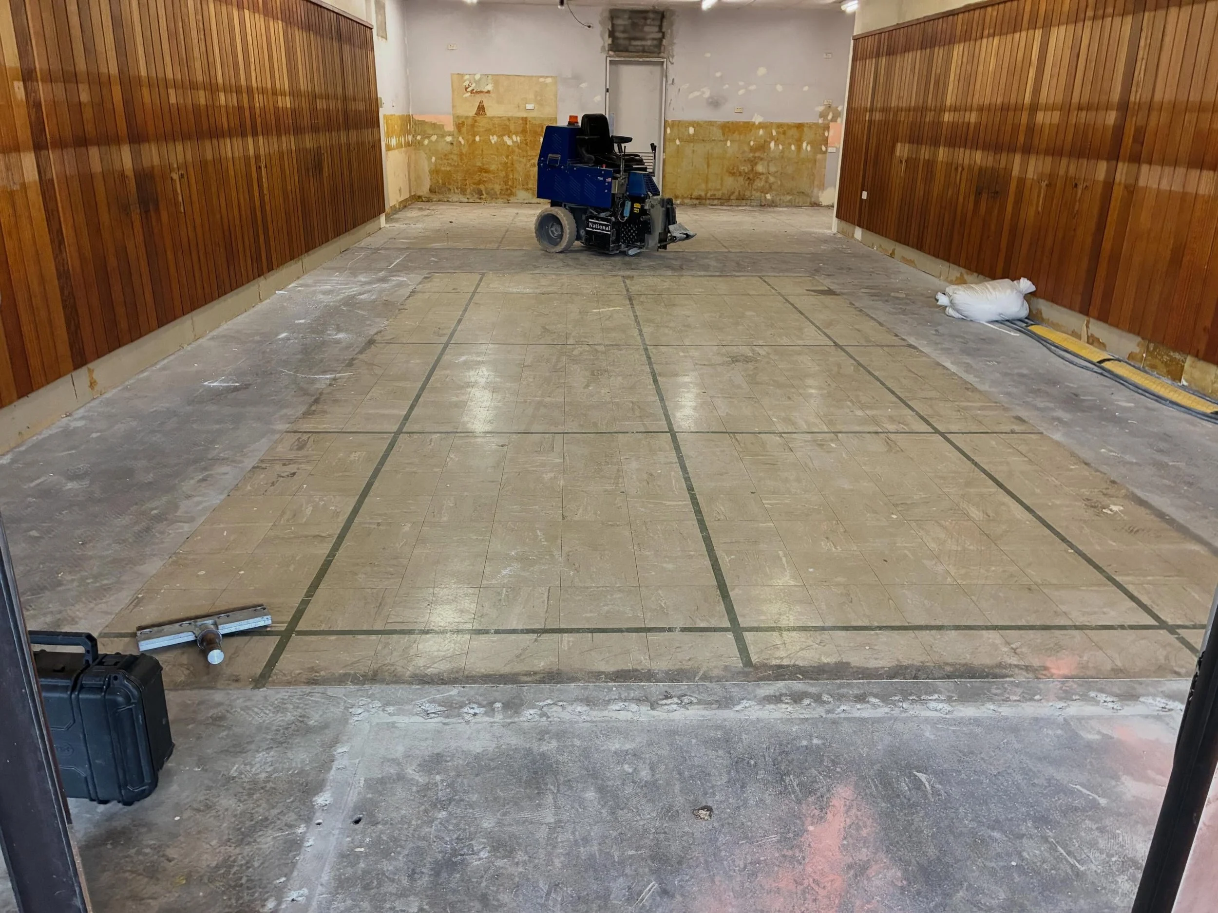 🏗️ Blank canvas, unlocked.

This commercial space was sitting on a sea of old VCT tile and adhesive &mdash; not exactly lease-ready. We stripped it back, ground off the glue, and applied a water-based urethane coating to leave something clean, durab
