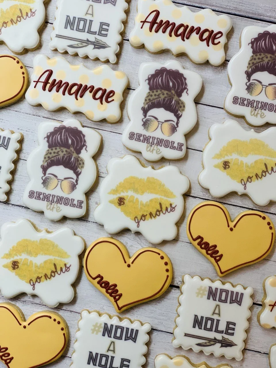 Decorated cookies with Seminole-themed designs, featuring phrases like "Seminole life," "#NOWANOLE," and "go noles." Some cookies depict lips and hearts.