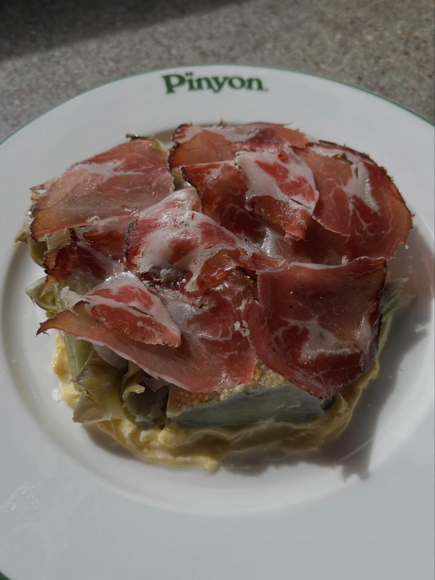 OJAI DISPATCH

The OG menu is replete with springtime delights this week. First up, @mendozafamilyfarms artichokes. Poached, wood fired, laid on a pillow of chile de &aacute;rbol aioli, and draped with @incontrocured Sicilian coppa. A primeval pinyon