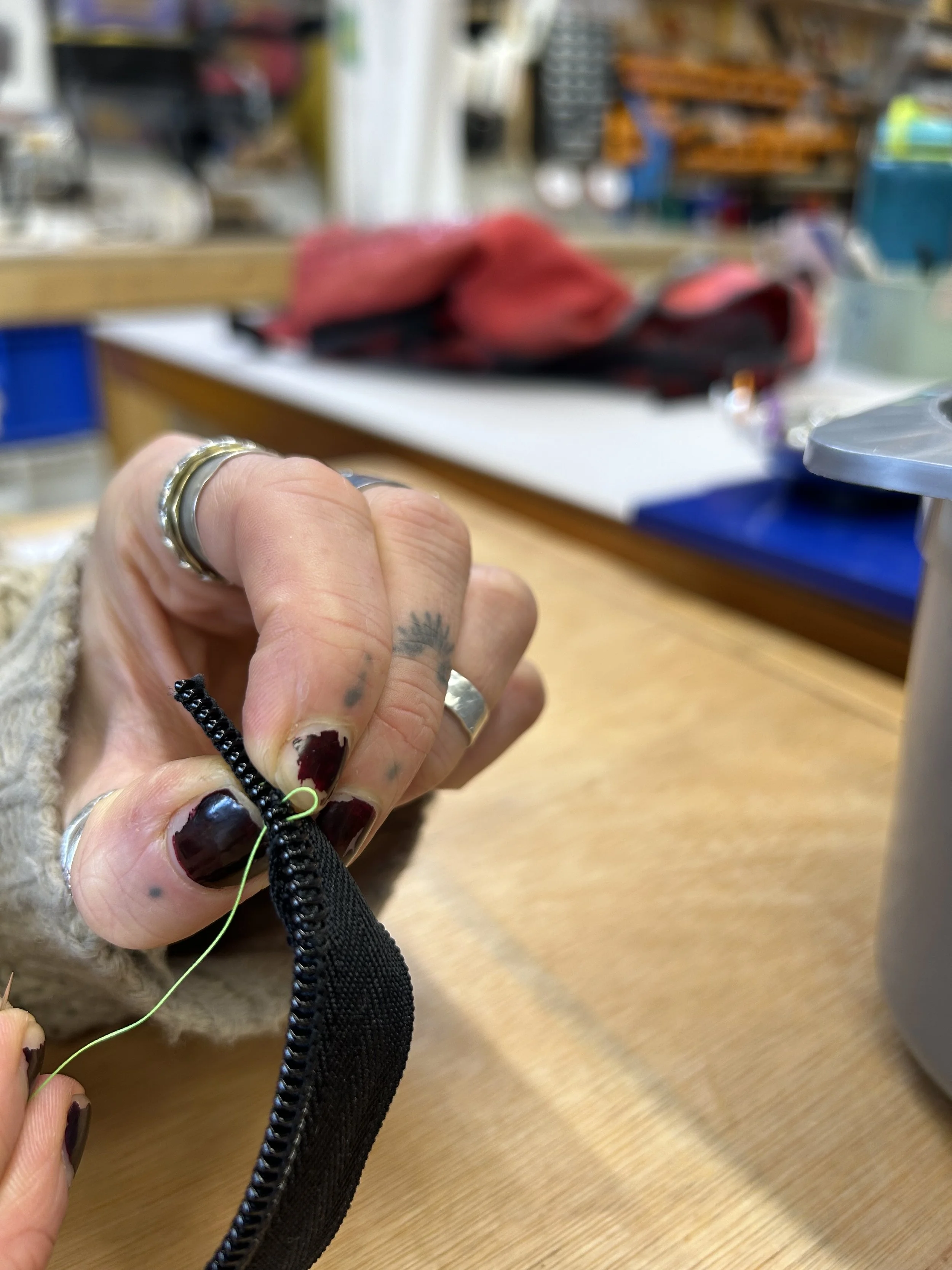 zip-repair-with-hand-stitching.jpeg