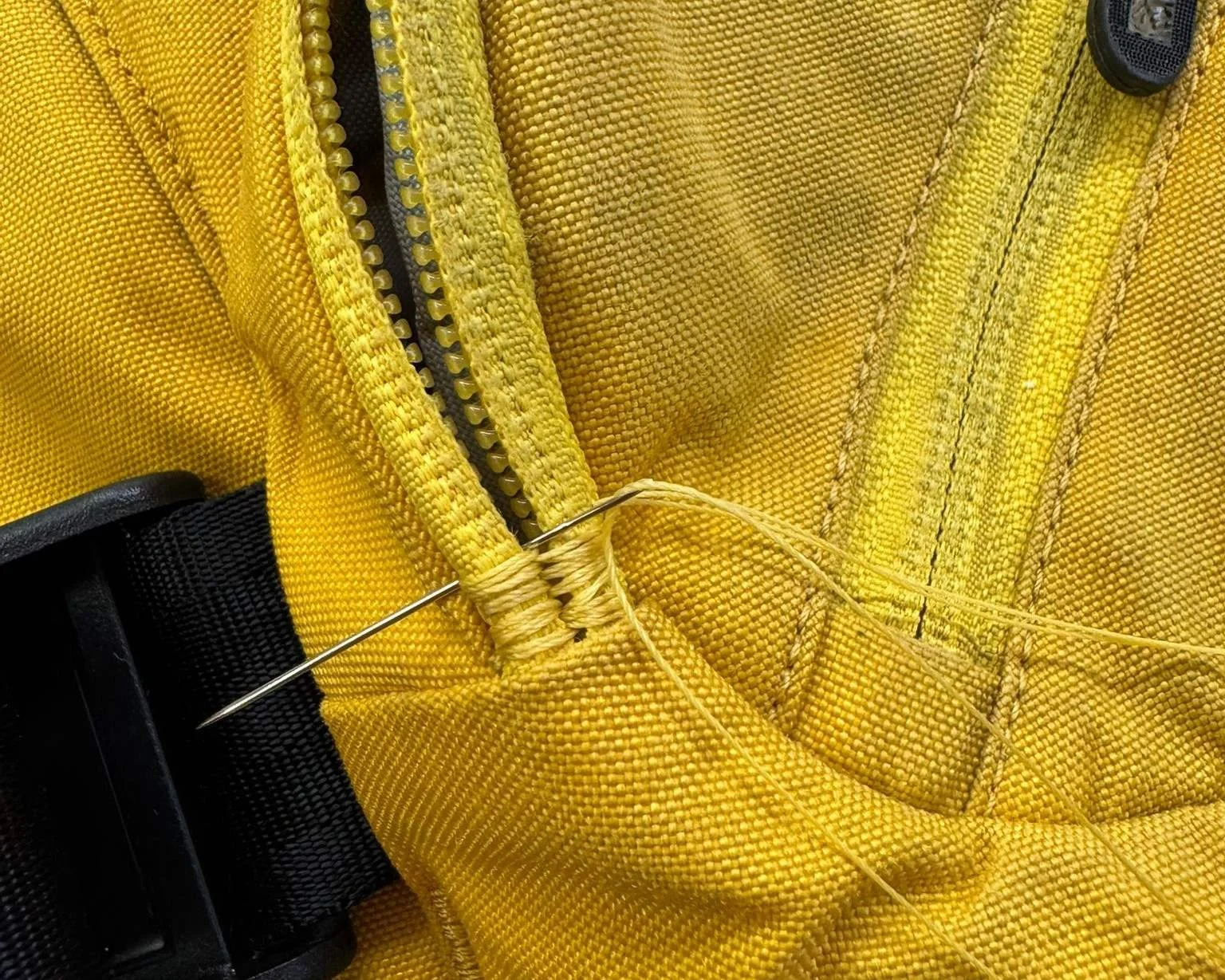 Needle and thread fixing backpack zip