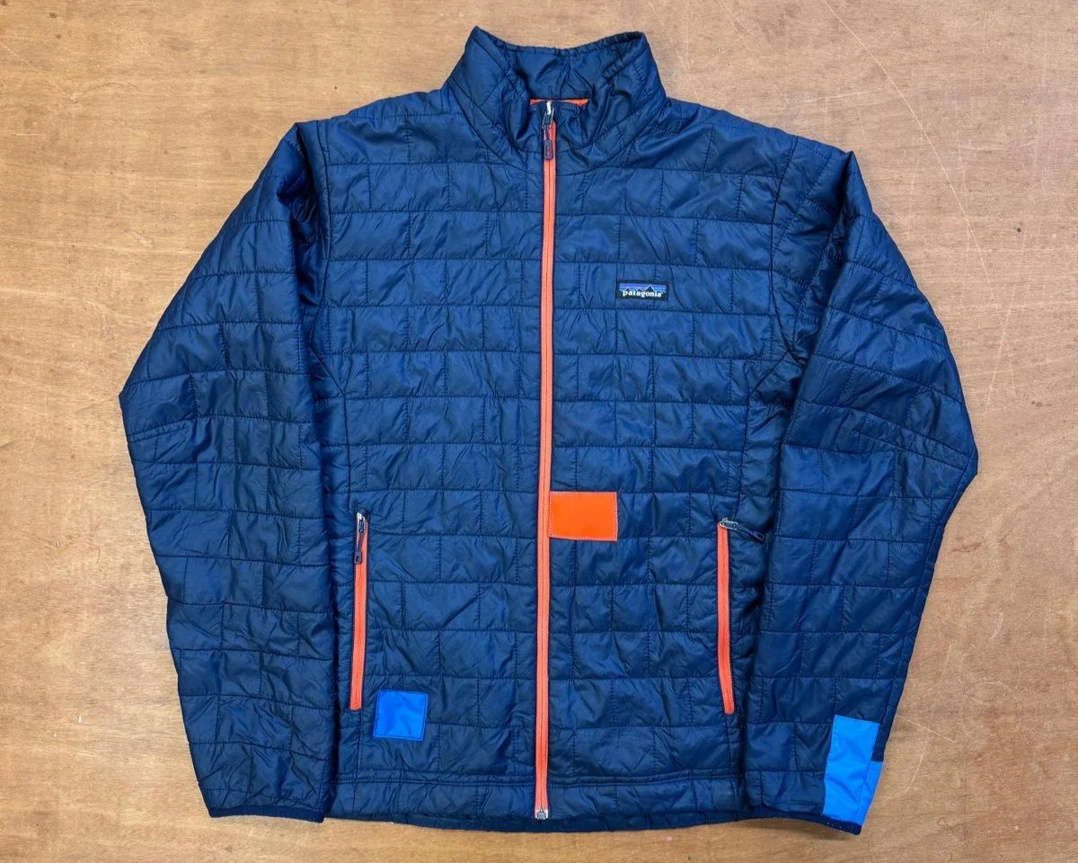 Blue and orange patches on patagonia jacket