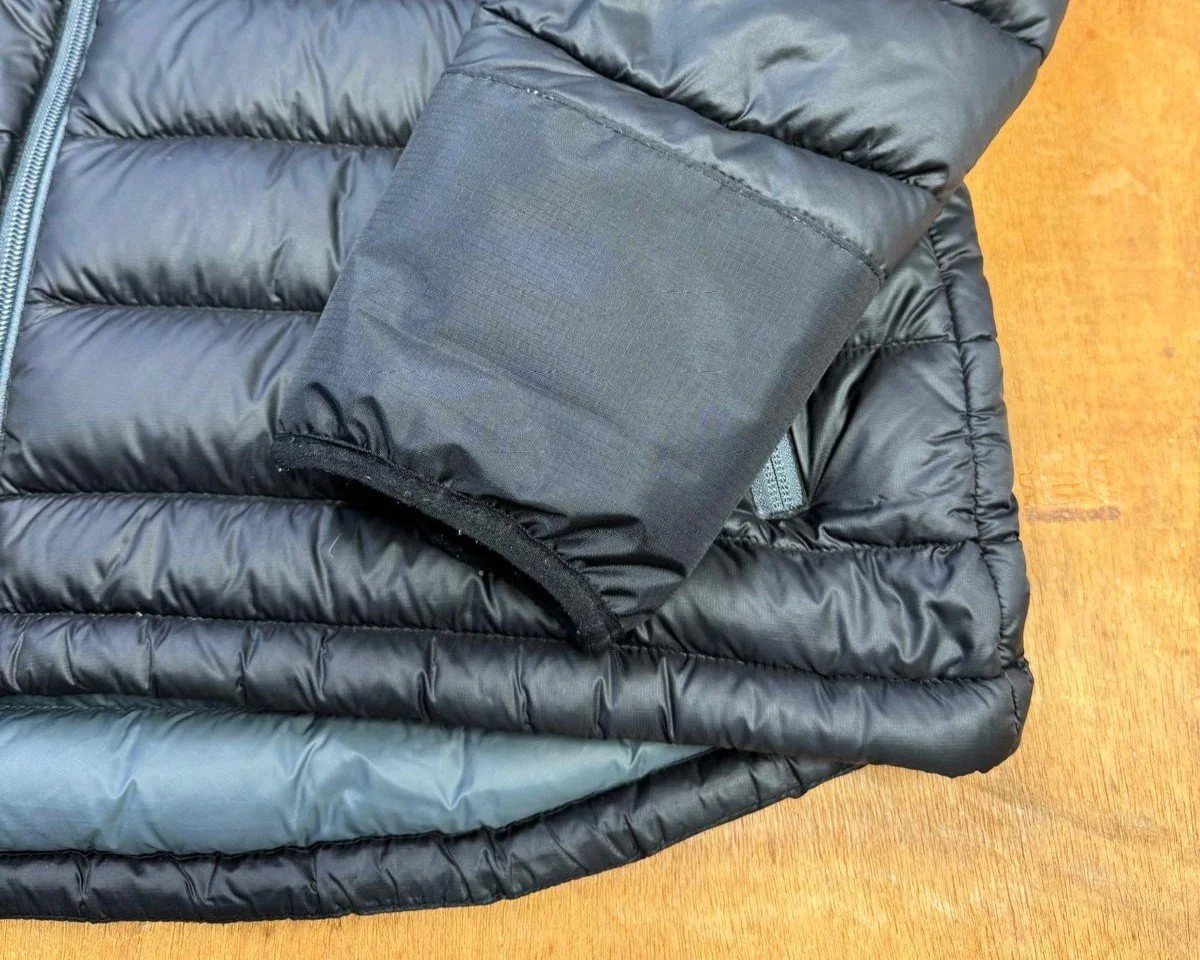 reconstructed cuff on black down coat