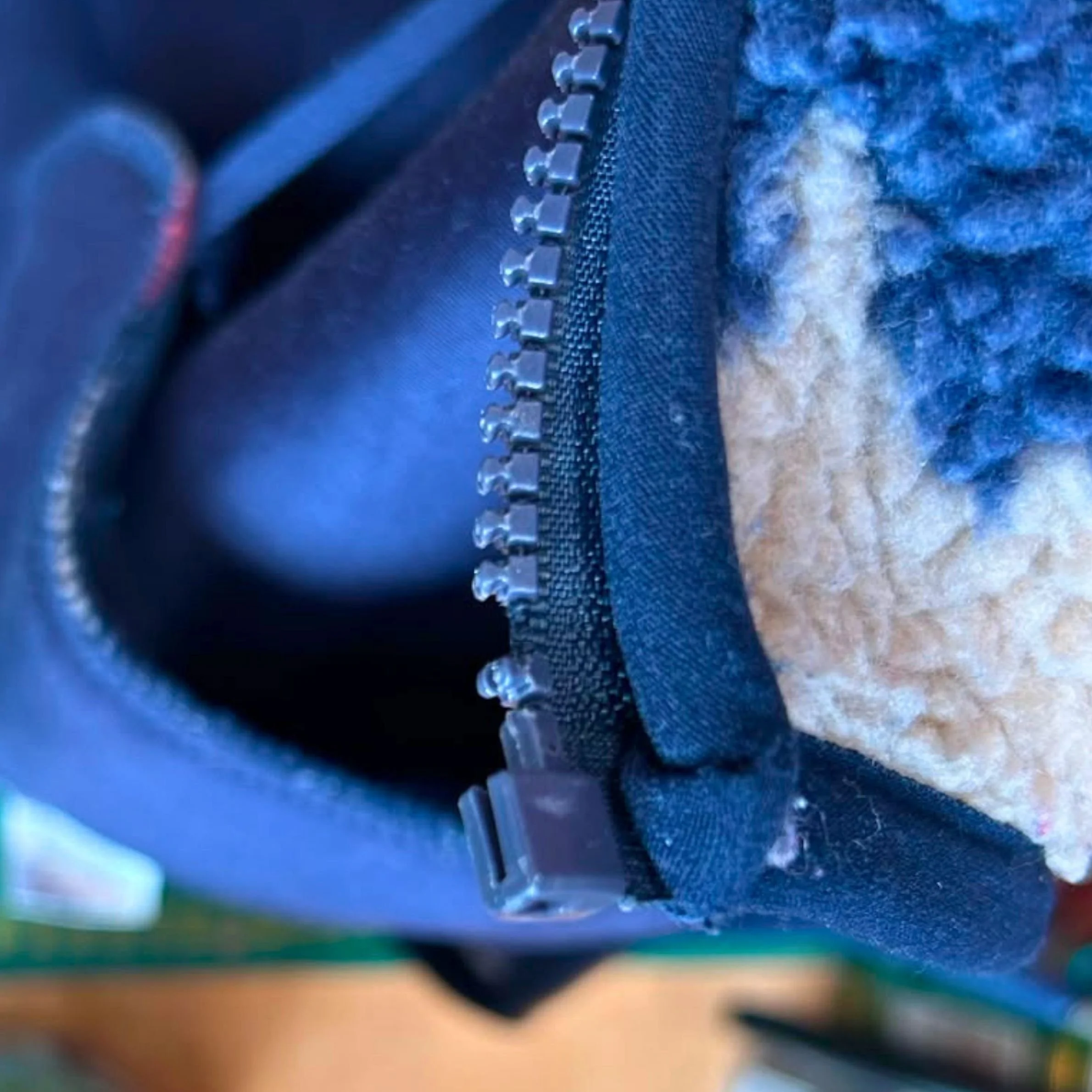 a blue zipper has a tooth missing
