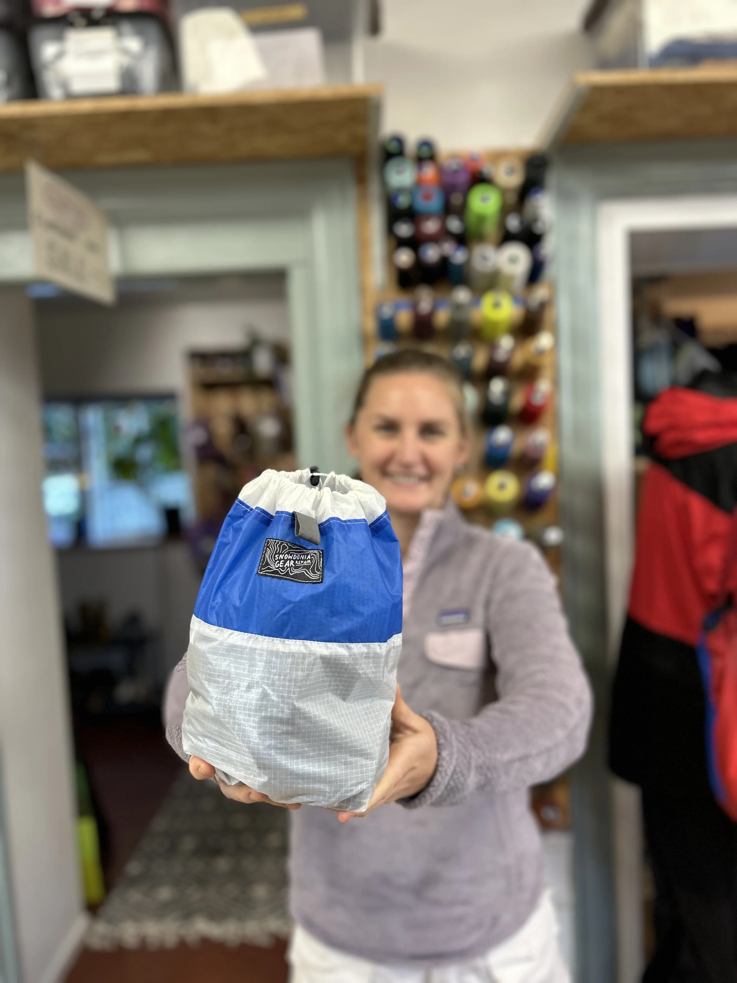 smiling-woman-holding-cinch-sack-1.jpeg