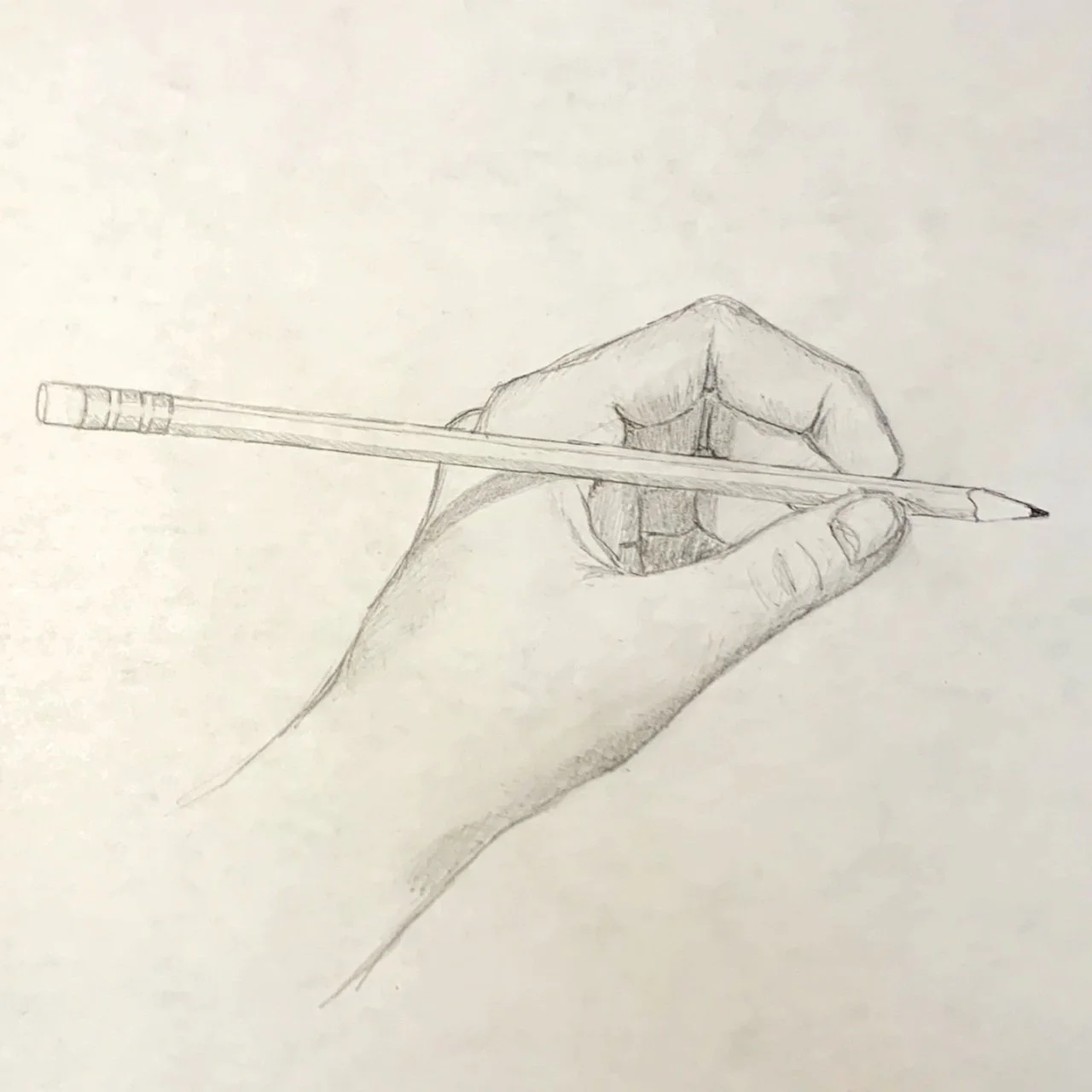 Pencil drawing of a hand holding a pencil