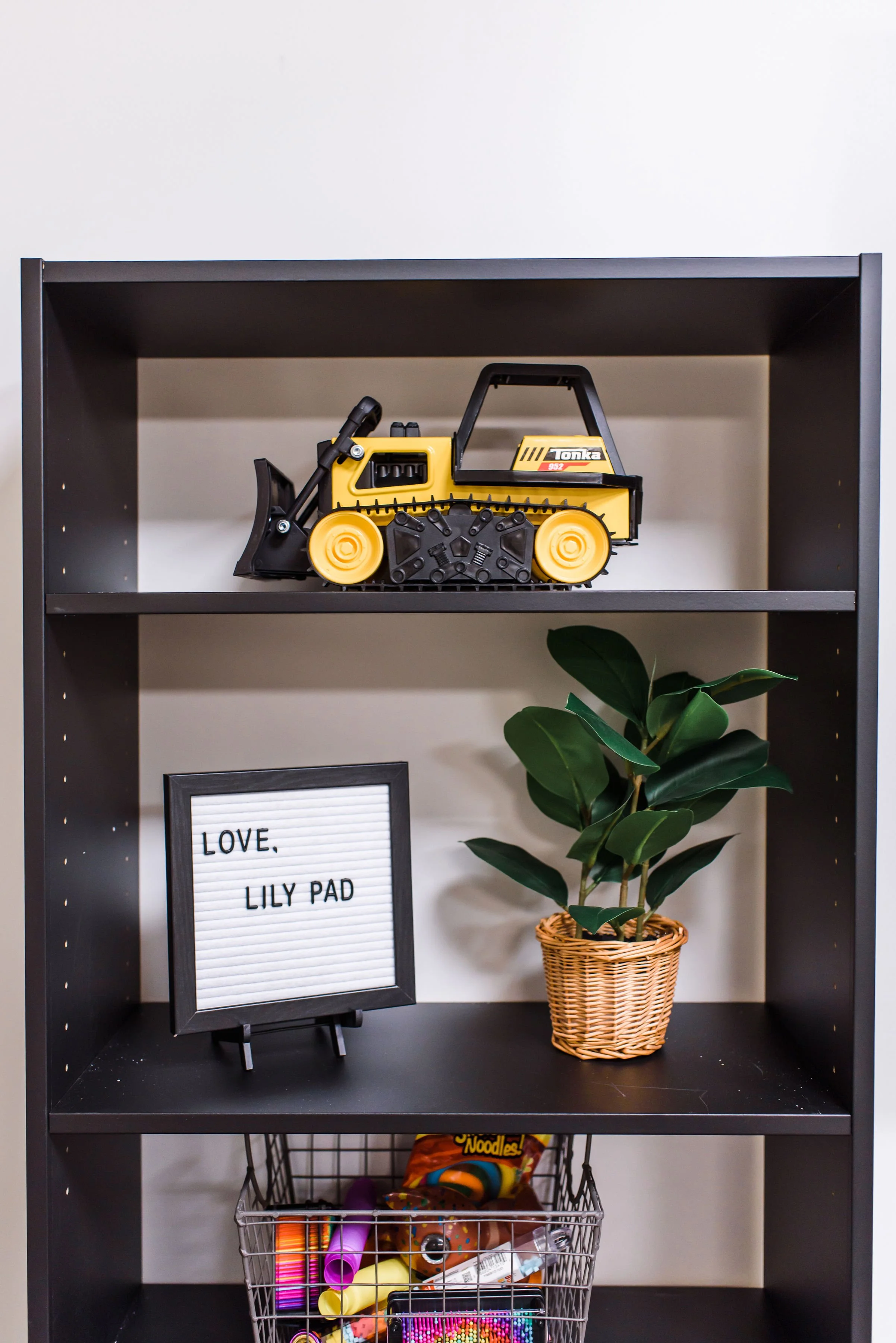 Each space includes a sensory toy bin full of squishes, pop its and other fidget toys