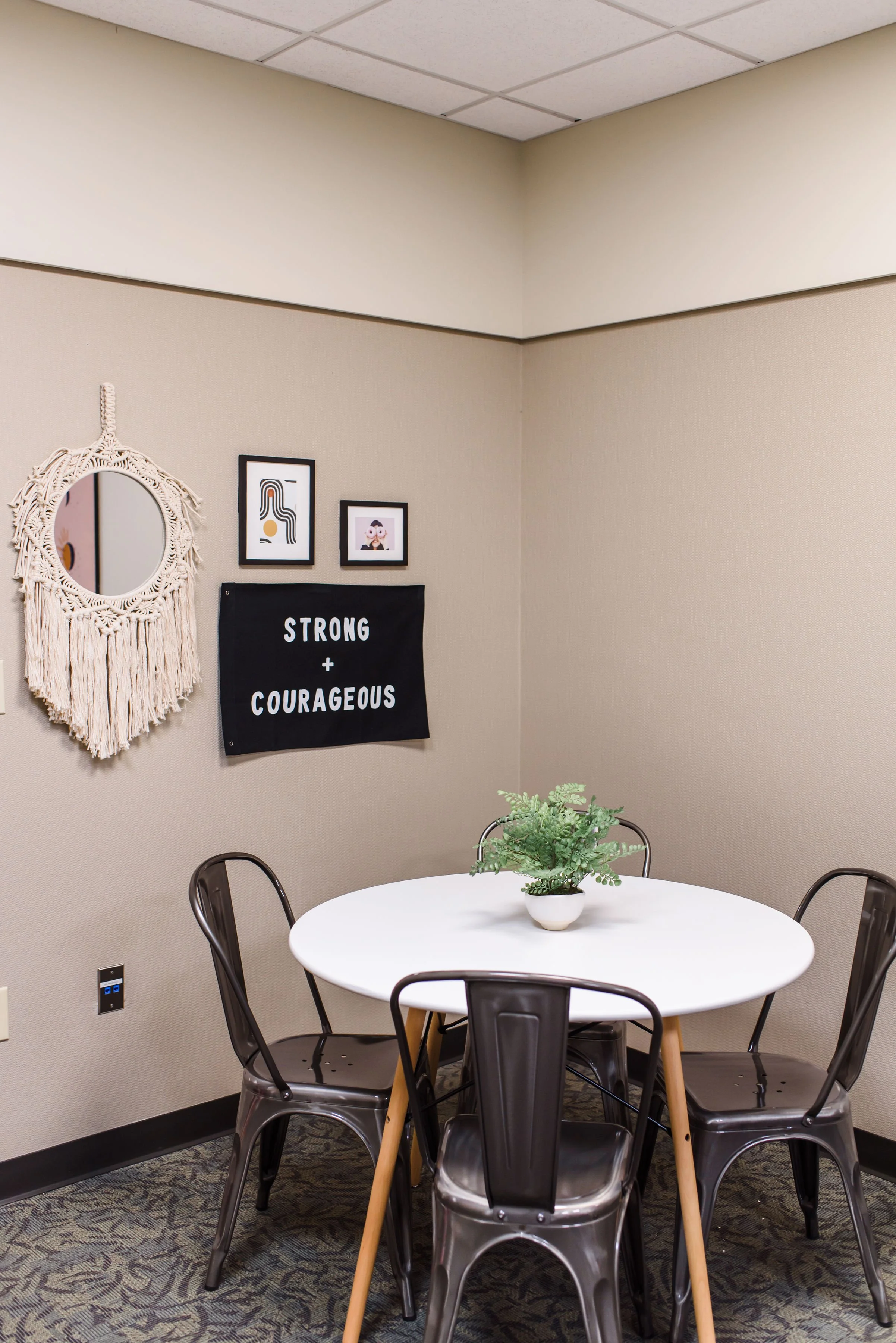 A table for eating, crafts, or the occasional meeting. The "Strong & Courageous" flag was generously donated for this space from CJLA HOME. @CarlyJeanHome on Instagram. 