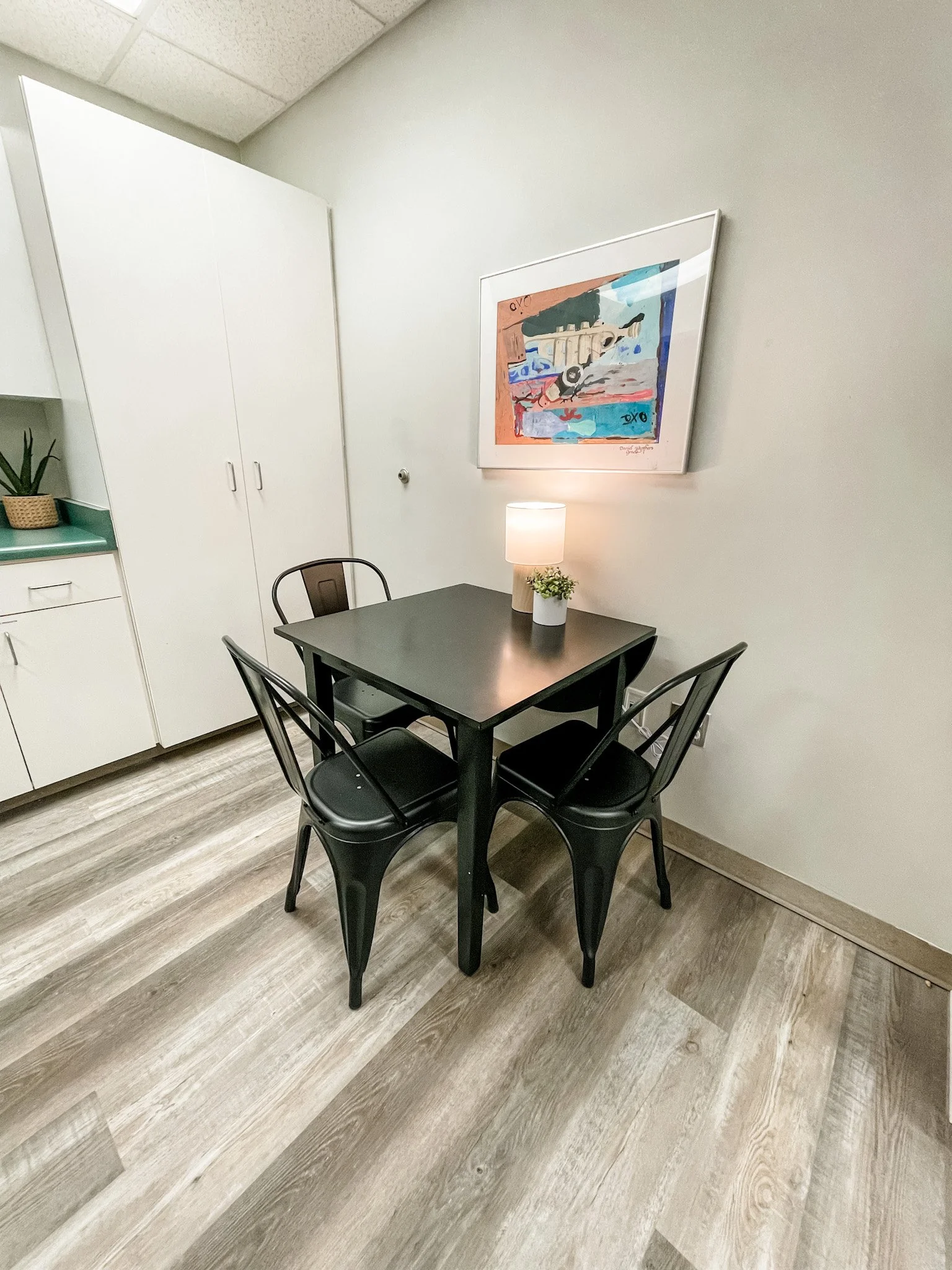 A kitchen table provides a place for a sibling group to eat a meal together or a case manager to work while supervising a child. 