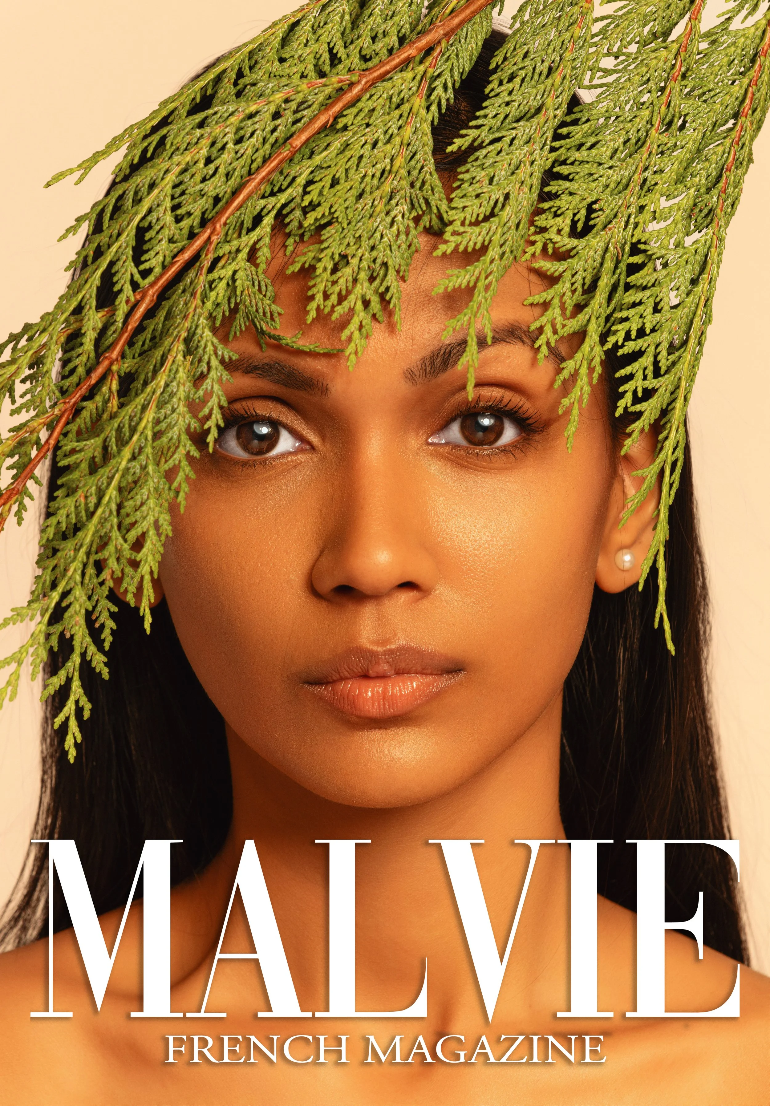 Cover of Malvie French Magazine featuring a woman with dark hair and a pearl earring, with green fern leaves draped over her forehead.