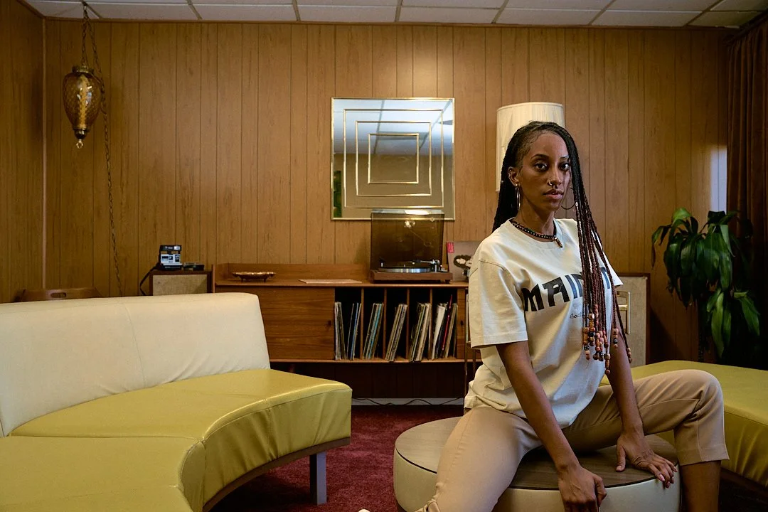 "Logo and merchandise of the MAINLND brand, showcasing stylish apparel and accessories with a modern, urban aesthetic."