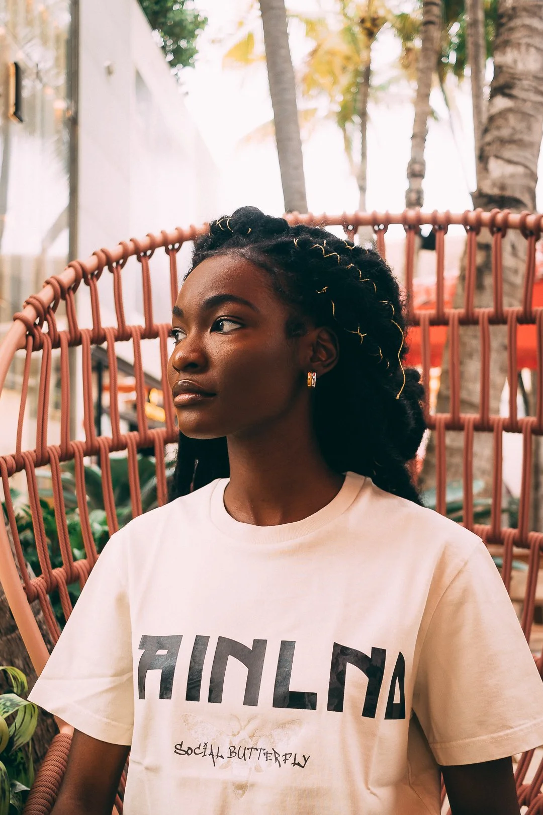 "Stylish model wearing trendy urban streetwear, featuring bold designs and casual, modern fashion."