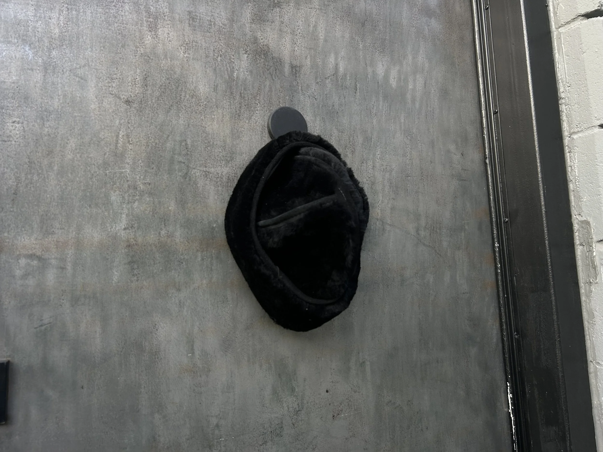 HANGING SHEEPSKIN HAT.JPG