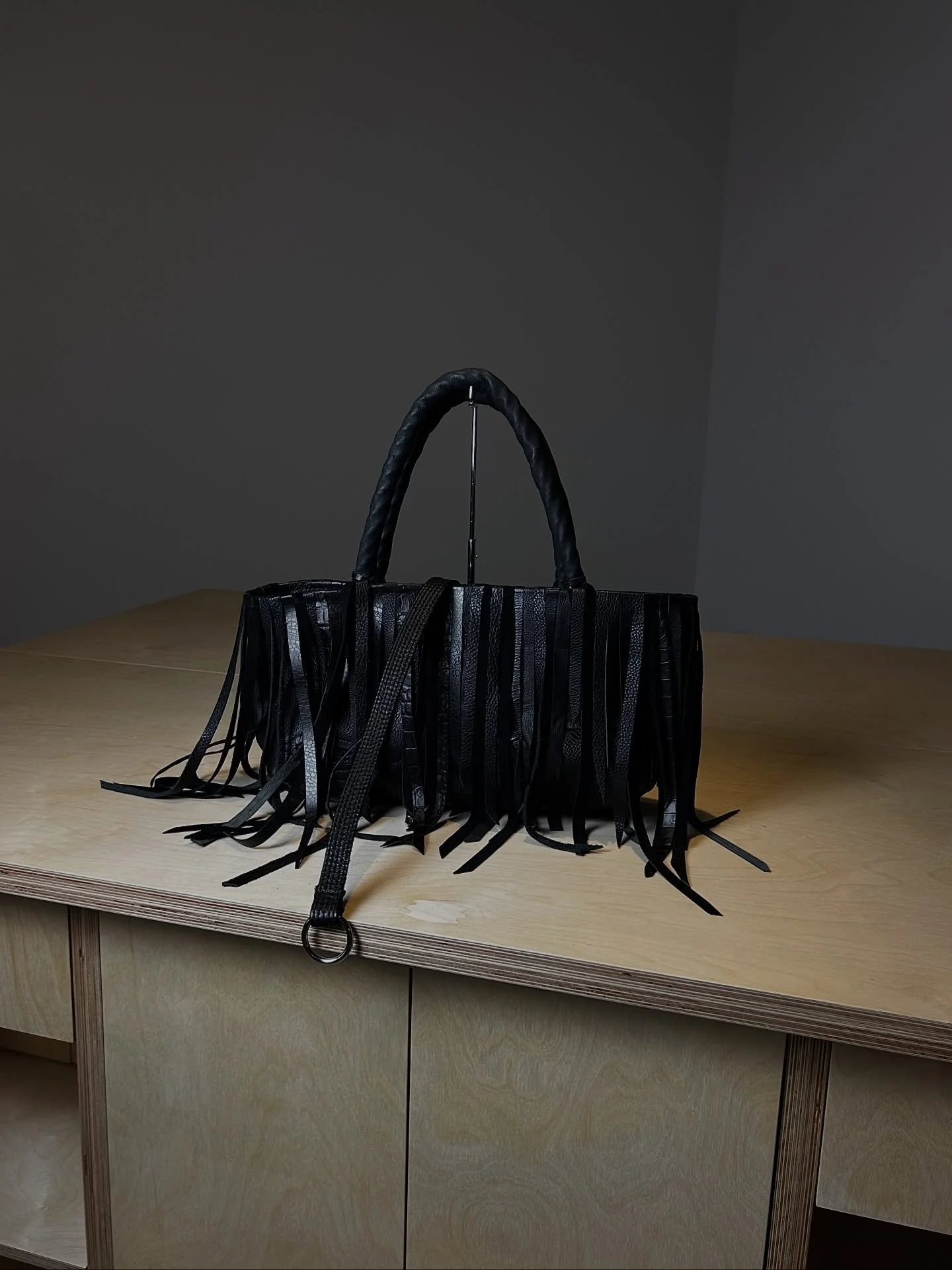 DIGO STUDIO BAG - Made with remnants and scraps from upcoming FW25 collection for &quot;The Company We Keep&quot;; Gallery at the Found Studio. 

Body created in layered and woven leather scraps, with leather fringe. Straps made from twisted rope and