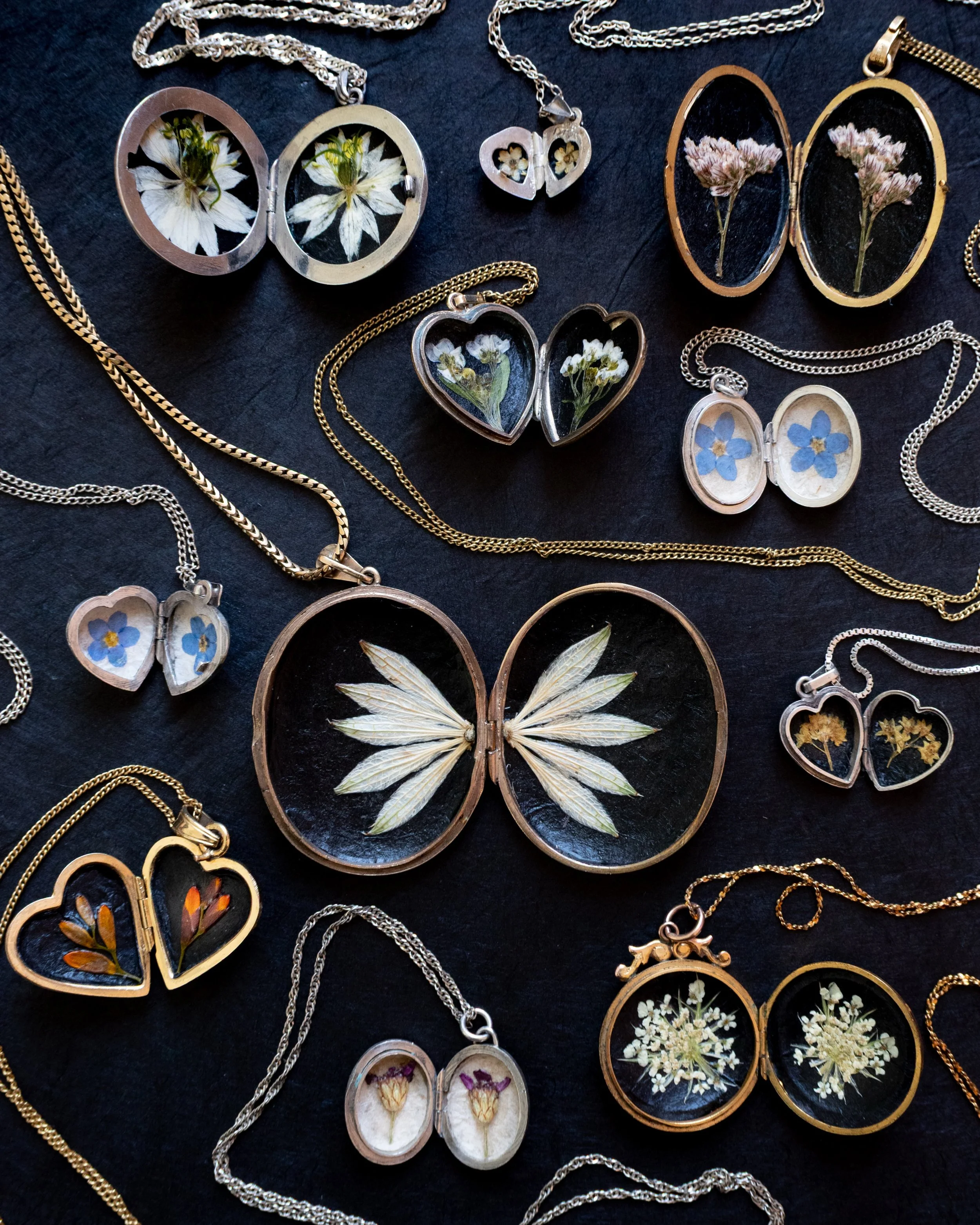 These beautiful symbolic pressed flowers are encased inside stunning vintage gold and silver lockets, each one is unique. There are flowers for love, remembrance, strength, new beginnings, protection and more - find them in the Meadow and Thyme websh