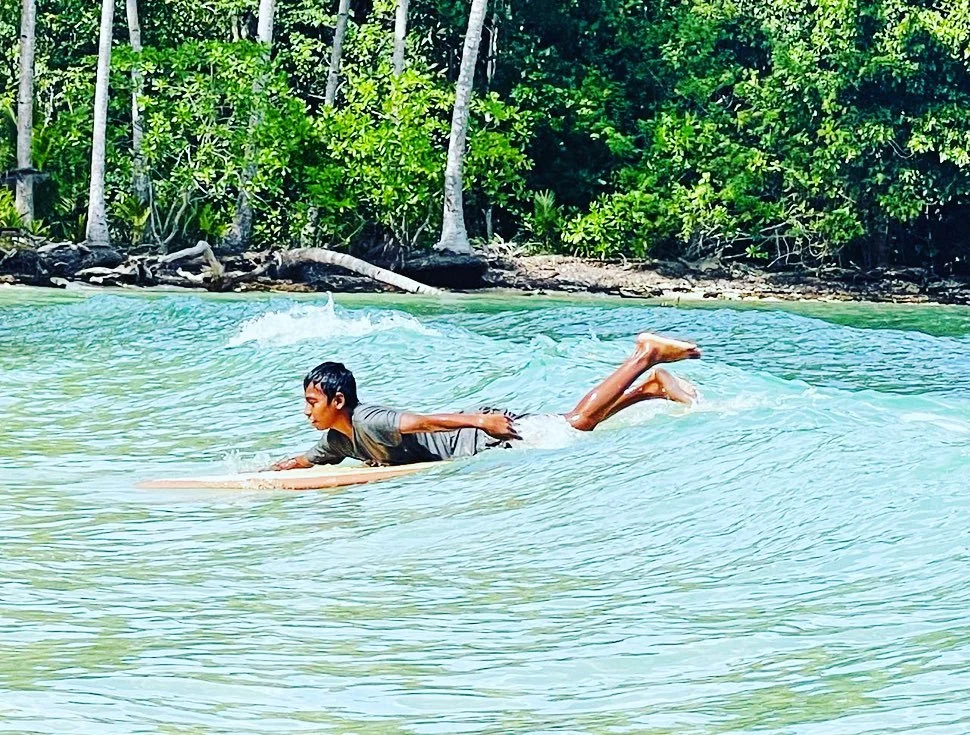 Stoke has no limits 🌊✨ @varuna_surf @aliquidfuture and @boboro_guesthouse just delivered boards to the local crew in Posi-Posi, and their joy was unstoppable - even riding finless and without leg ropes, they&rsquo;re pure proof that the heart of sur