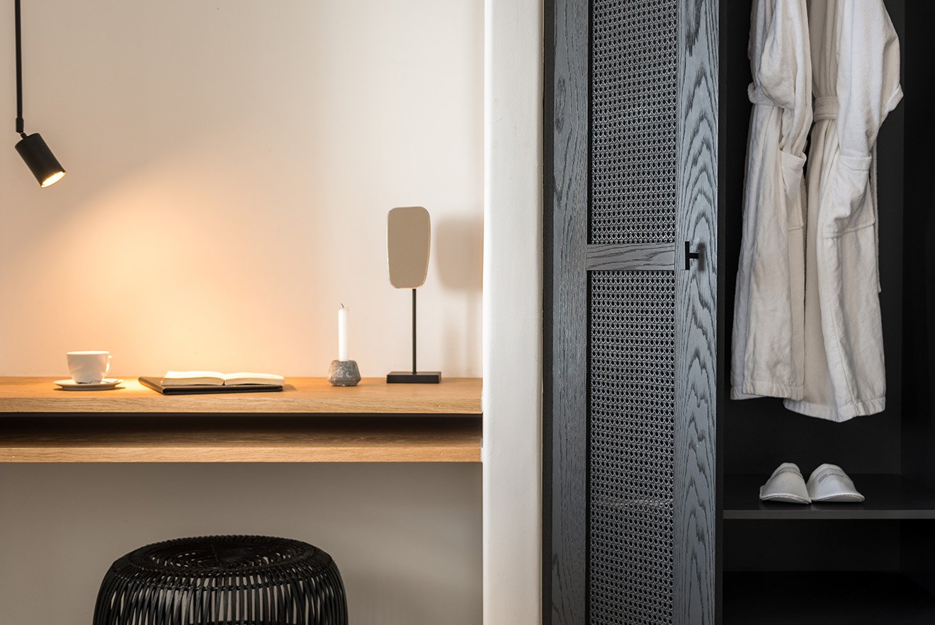 working desk space and storage by Laboratorium Porto Fira Suites.jpg