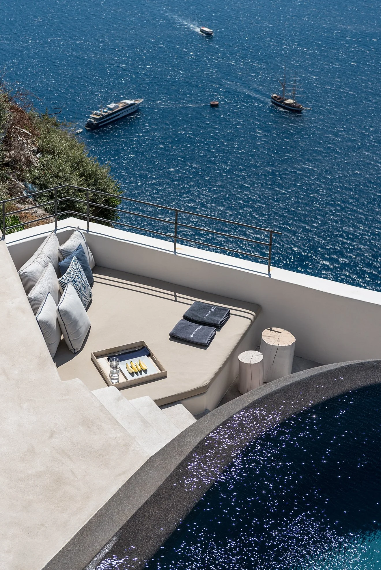 Luxury travel to Santorini infinity pool with view across teh sea.jpg