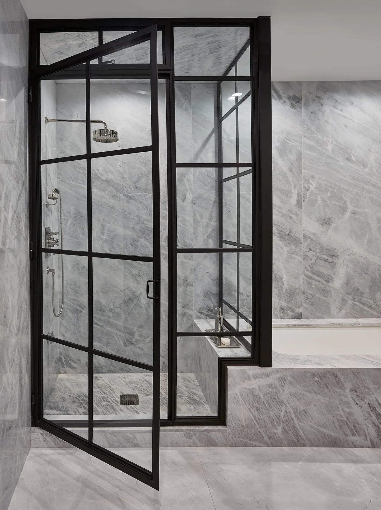 Grey marble bathroom with black industrial style framework.jpg