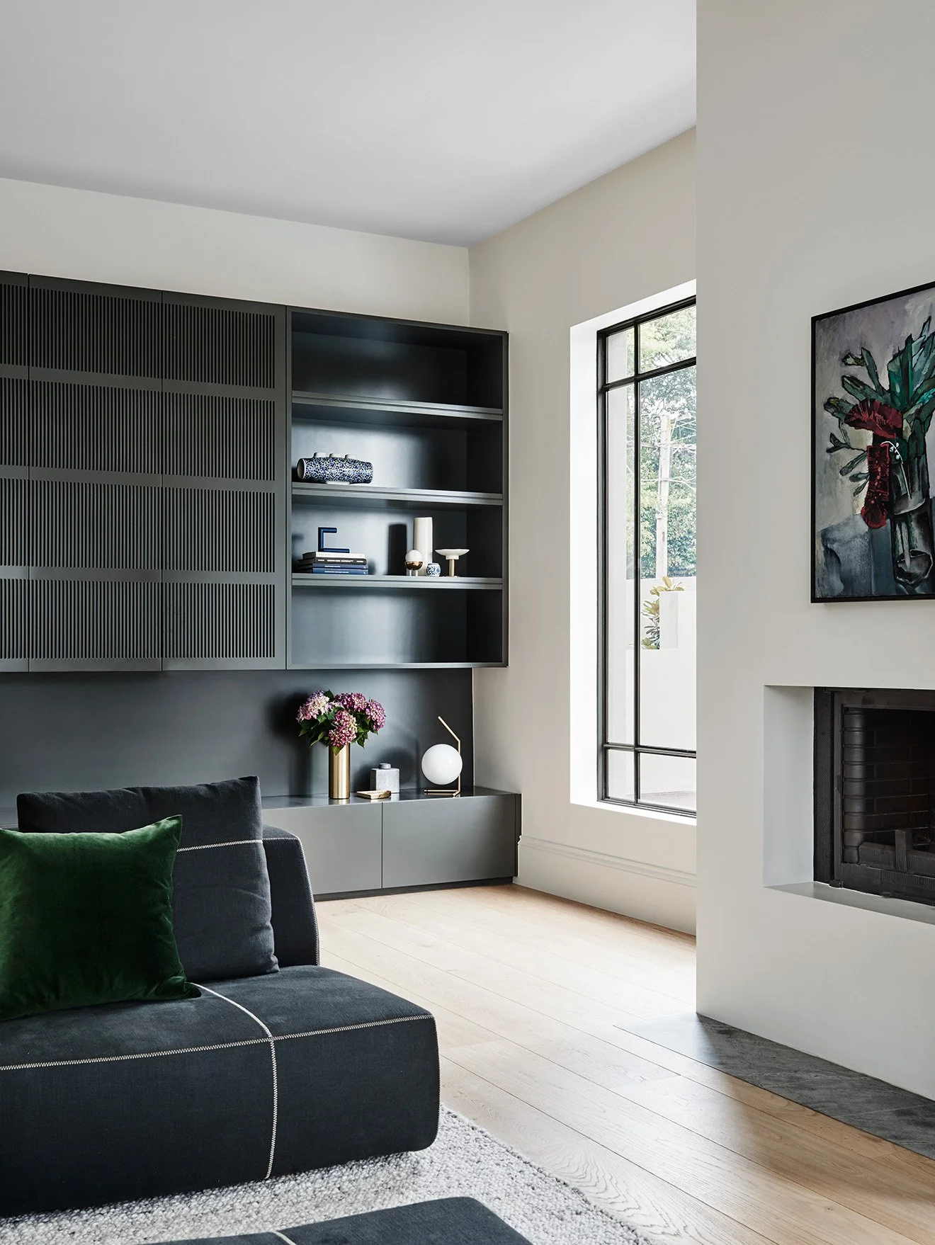 Robson Rak Interior Design grey wall storage with green and brass accessories.jpg