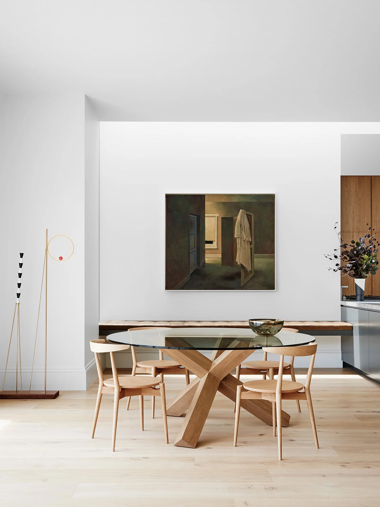 Robson Rak Interior Design large oak frame dining table with circular glass top.jpg