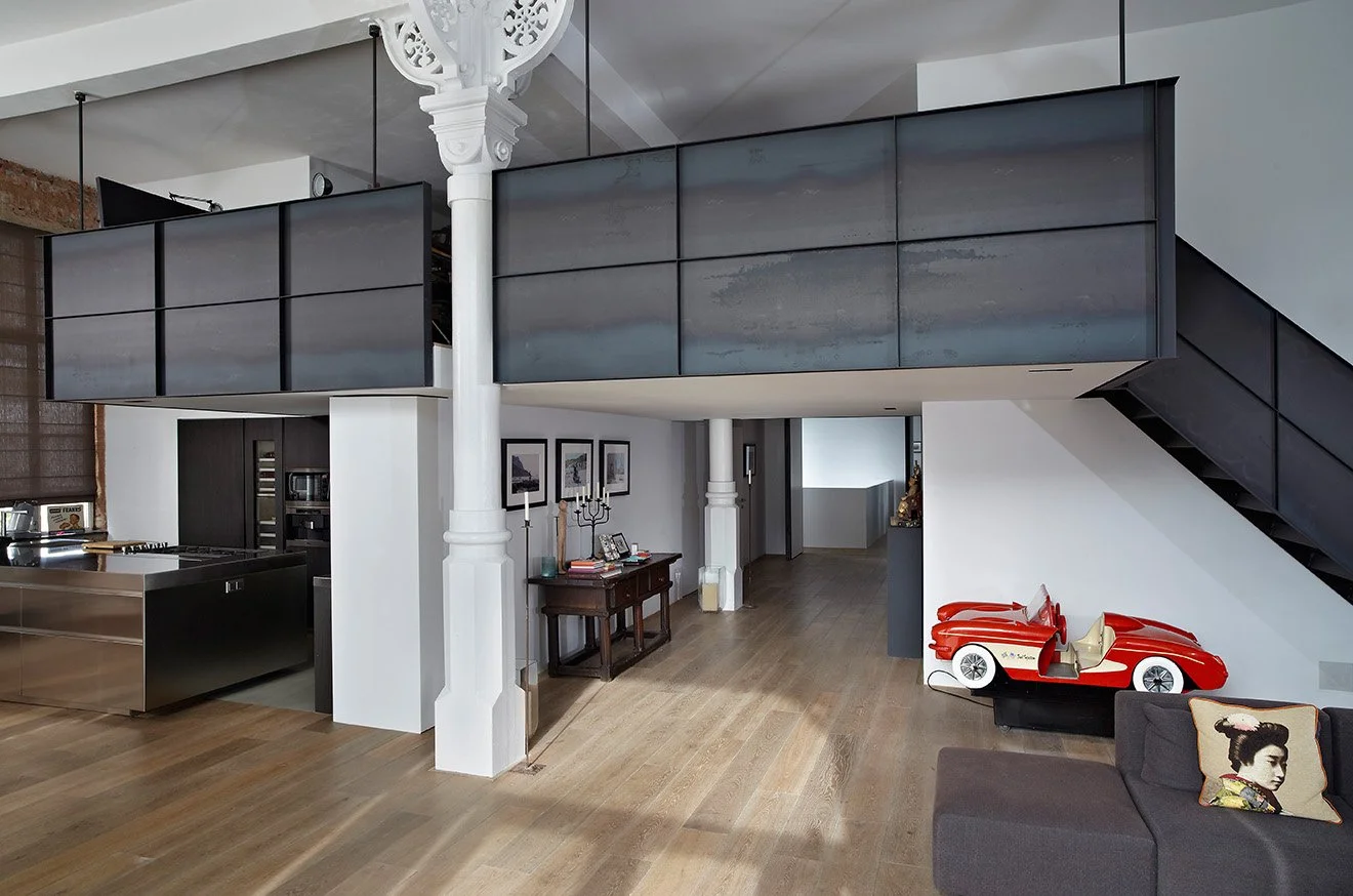 Canal House Amsterdam with suspended iron level above the kitchen and living space.jpg