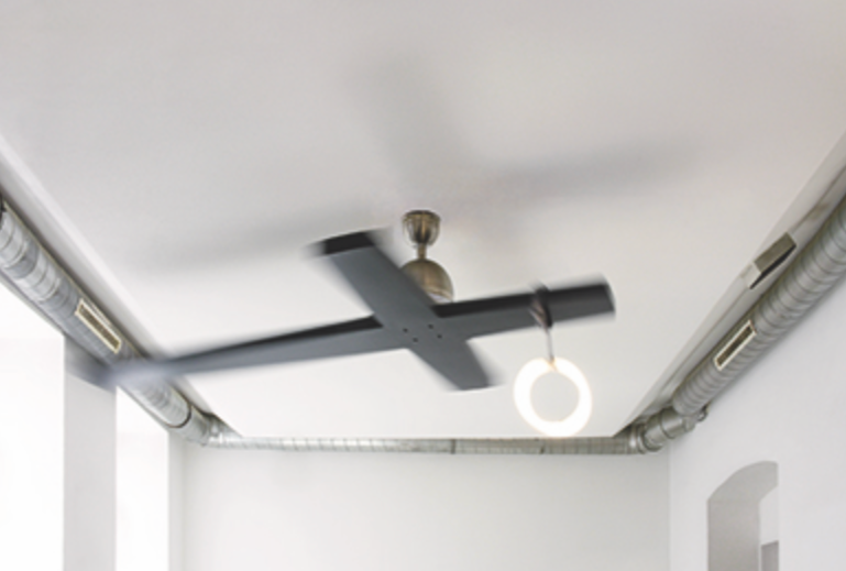 Ceiling fan and modern circular light fixture installed on white ceiling with visible air ducts.