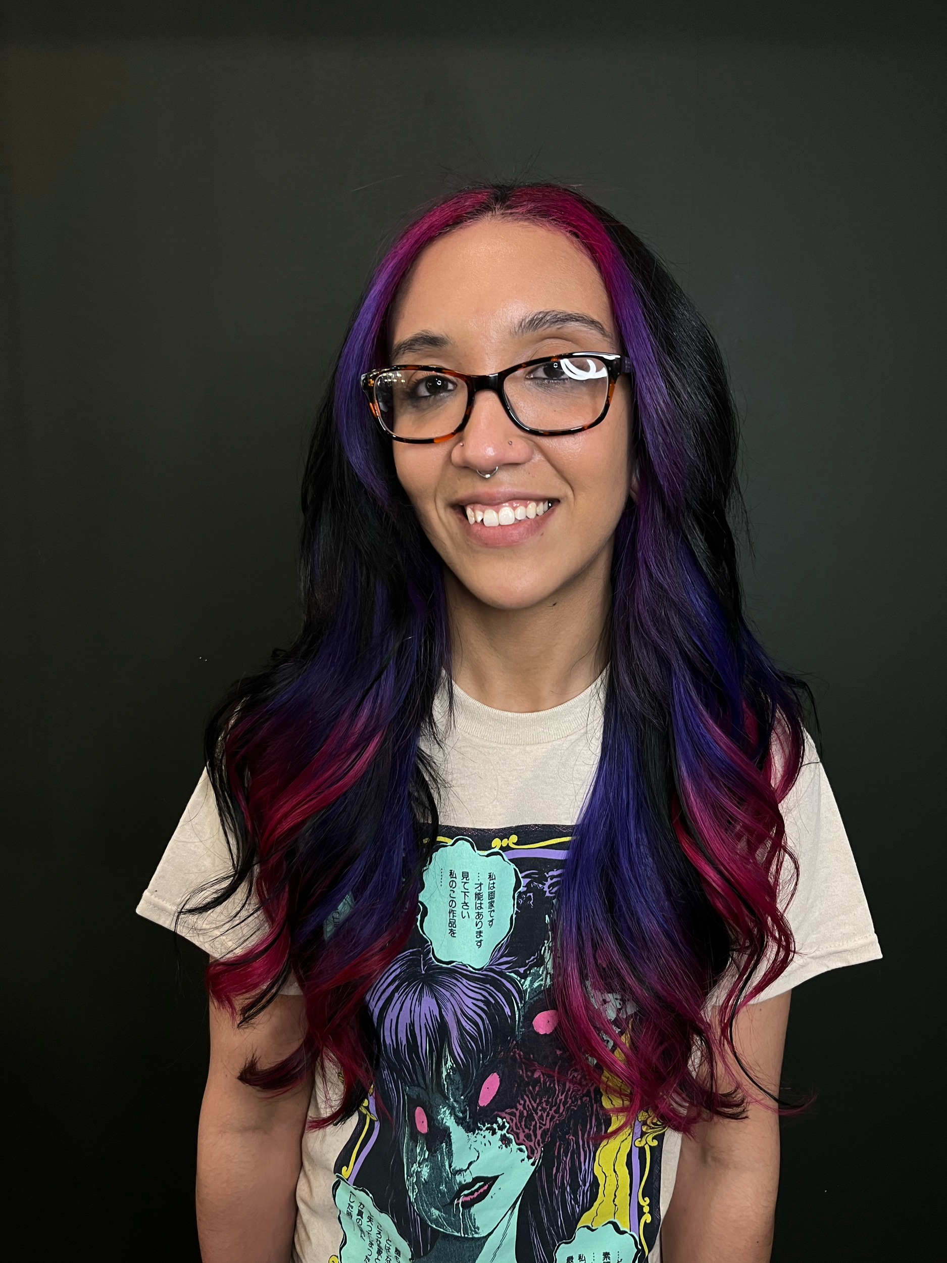 Black hair with vibrant pink and purple hair extensions, creating a bold, alternative hairstyle at Cult Studios, a gender-inclusive hair salon specializing in creative color and custom hair transformations in Fishtown, Philadelphia.